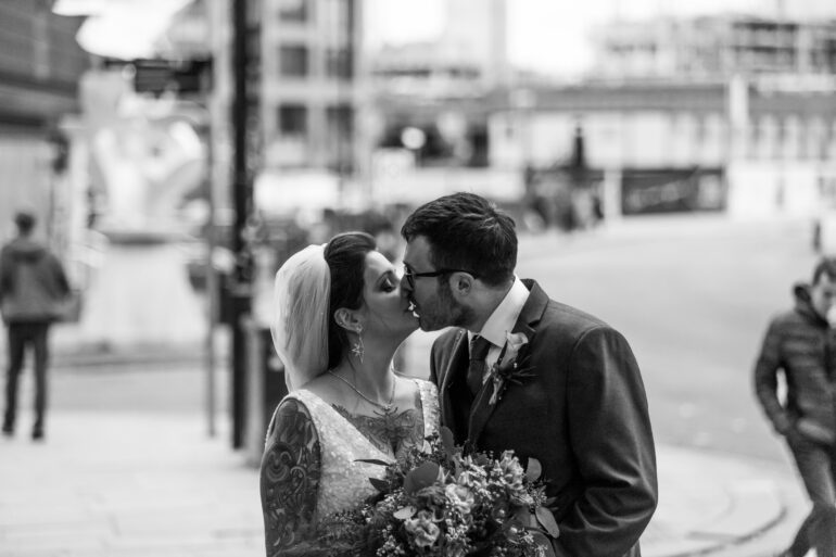 Bride and groom outside Manchester Hall