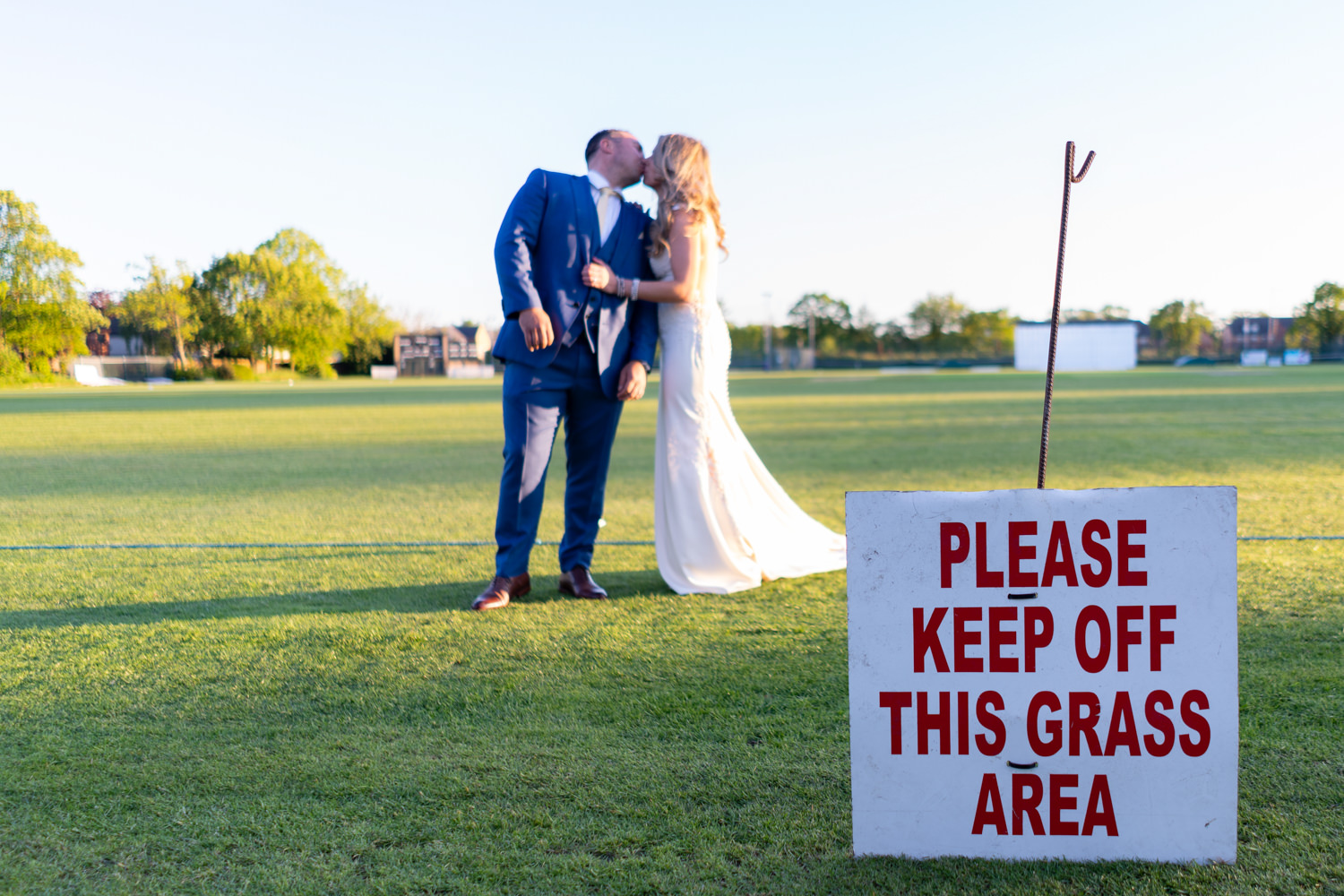 Bride and groom on Liverpool cricket club green