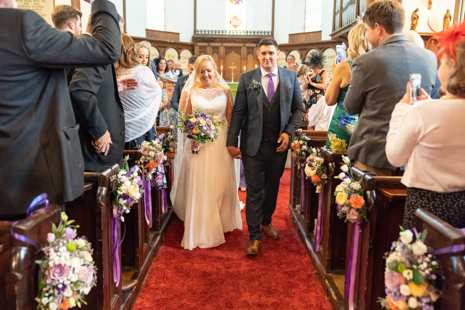 Bride and groom leaving together