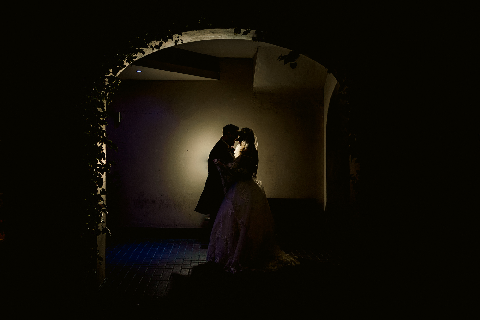 Bride and groom in the entryway to Everglades Hotel
