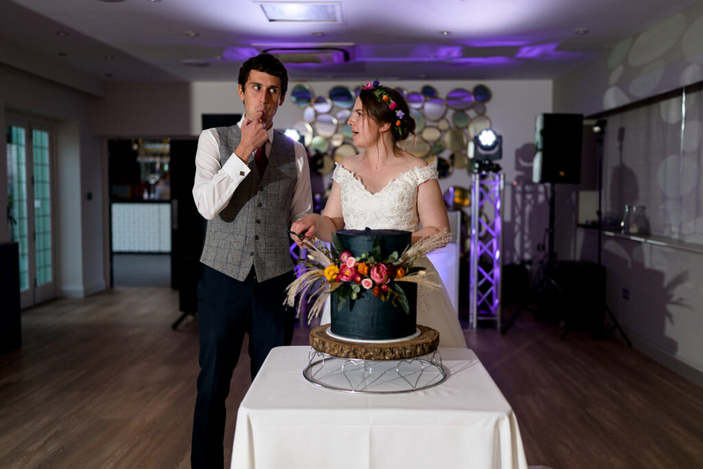 cutting the Wedding cake at Hogarths Hotel