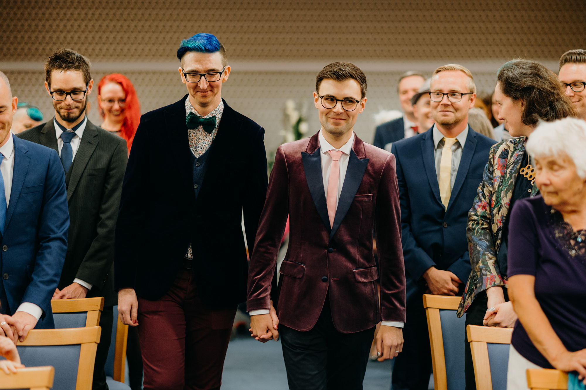 Grooms walking down the aisle together in Manchester registry office