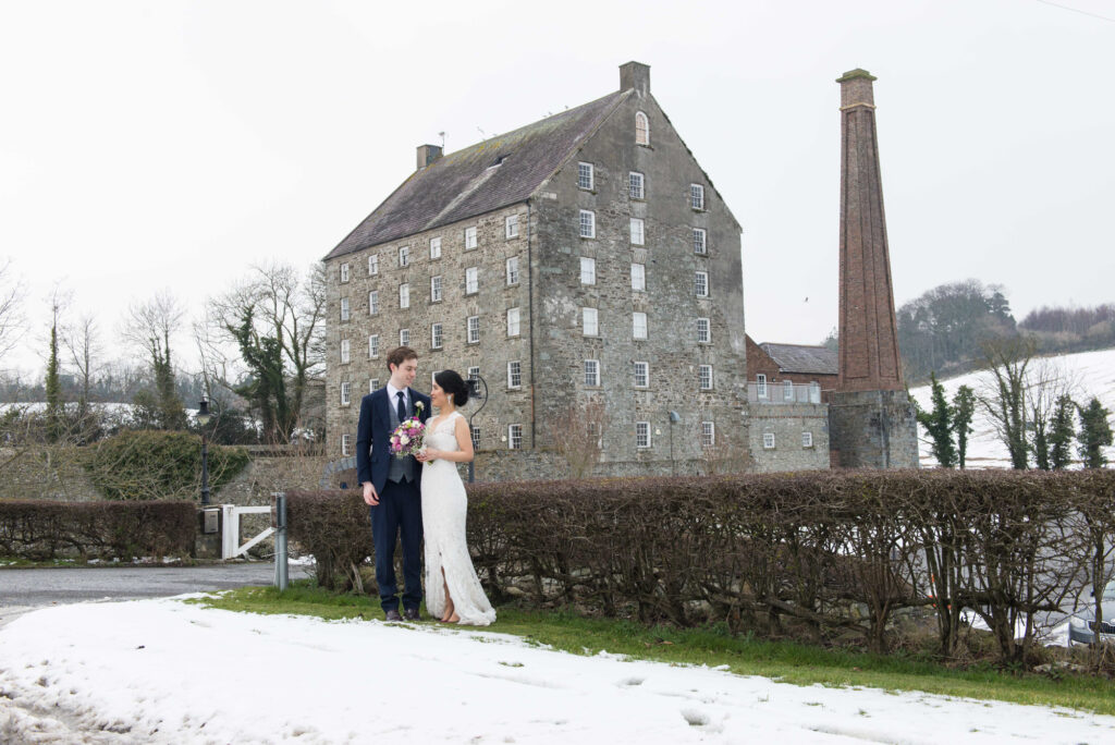 Bride and groom in front of the Mill at Ballydugan