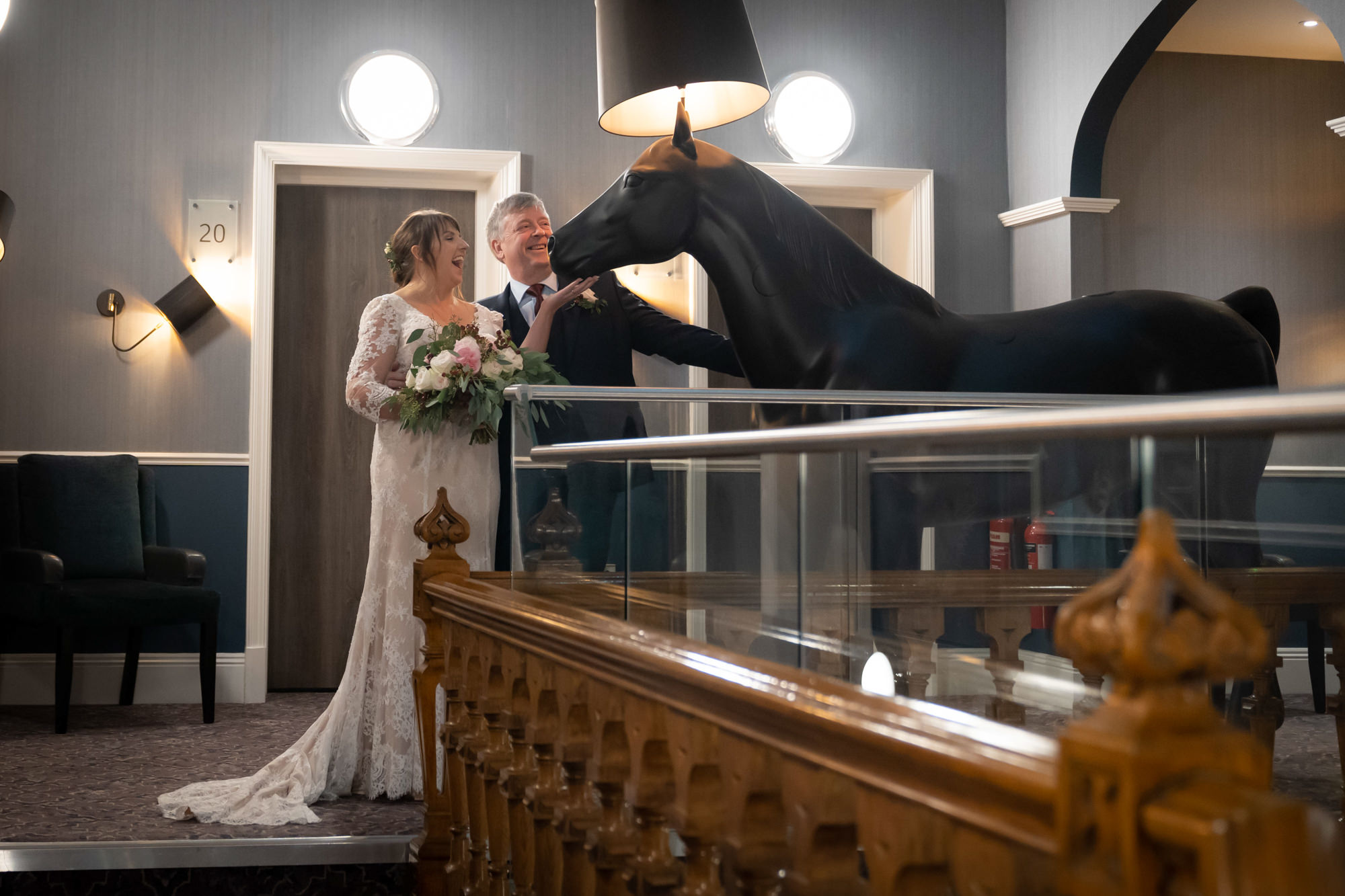 Bride and groom with a horse lamp at Oddfellows