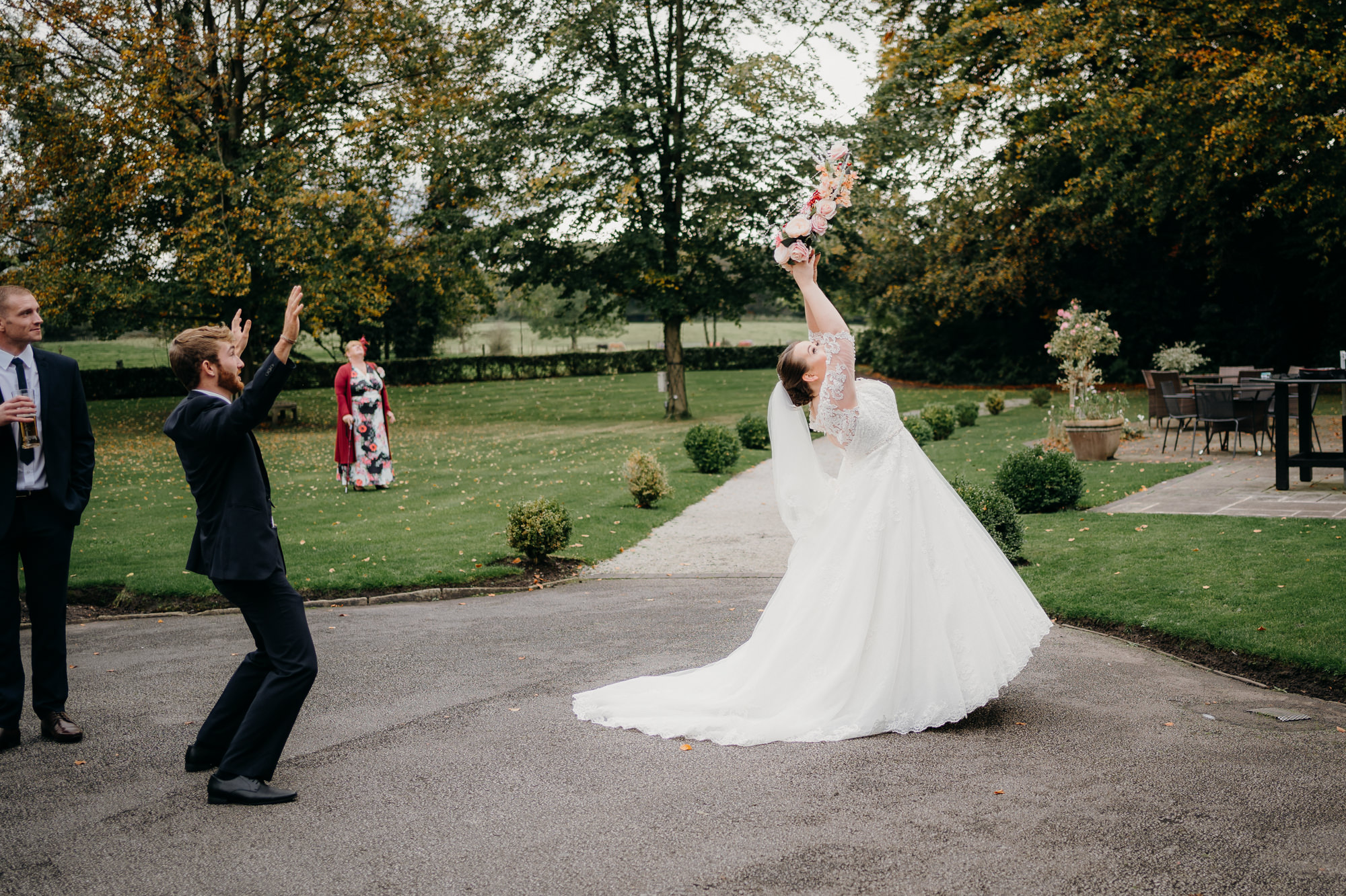 Bouquet toss at Statham Lodge Hotel