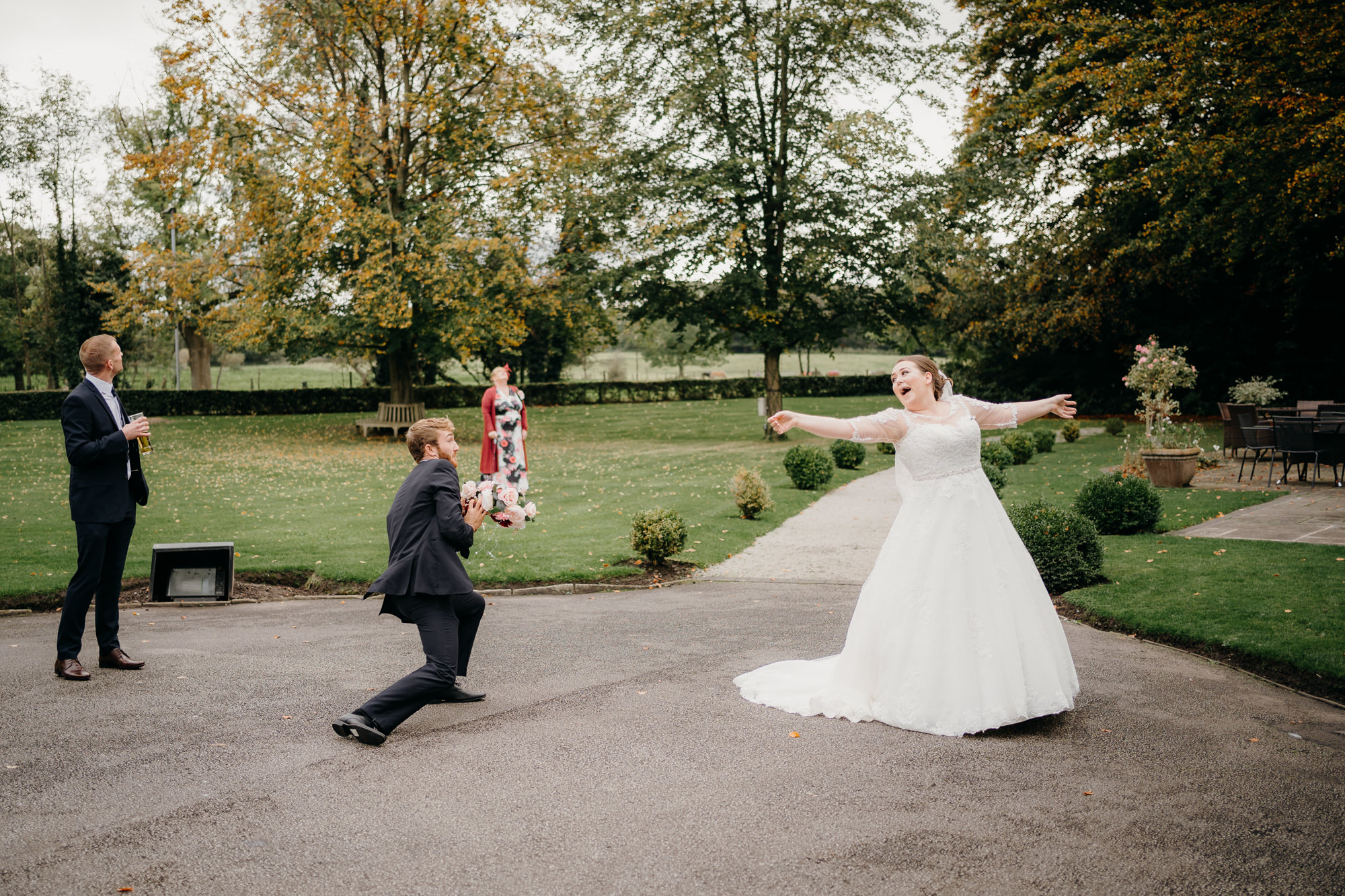 Bouquet toss at Statham Lodge Hotel