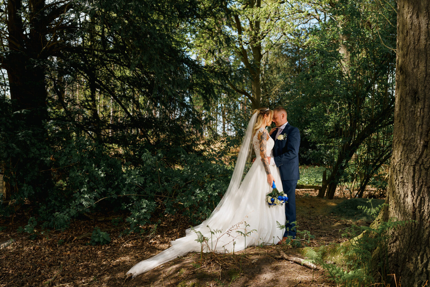Couple portrait in the woods at Peckforton Castle