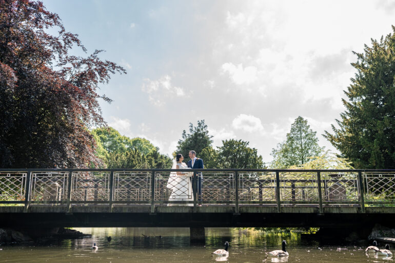 Bride and groom on a bridge in Buxton Park
