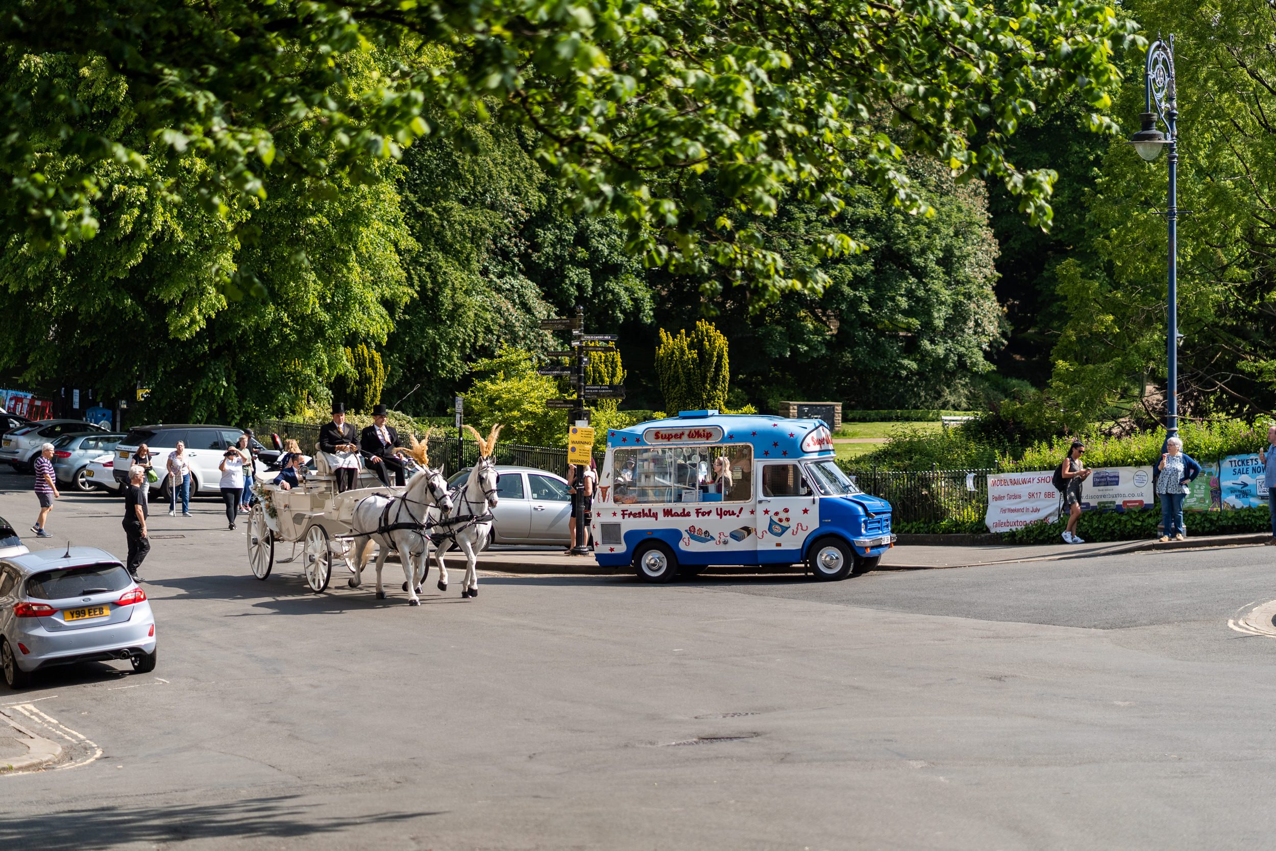 Horses and carriage with Ice cream van at Buxton Park