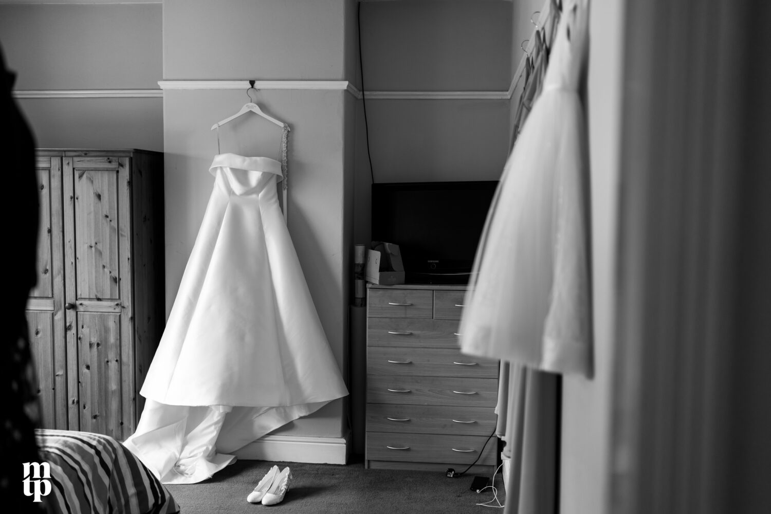 The bride's dress hanging in her home in Chorlton