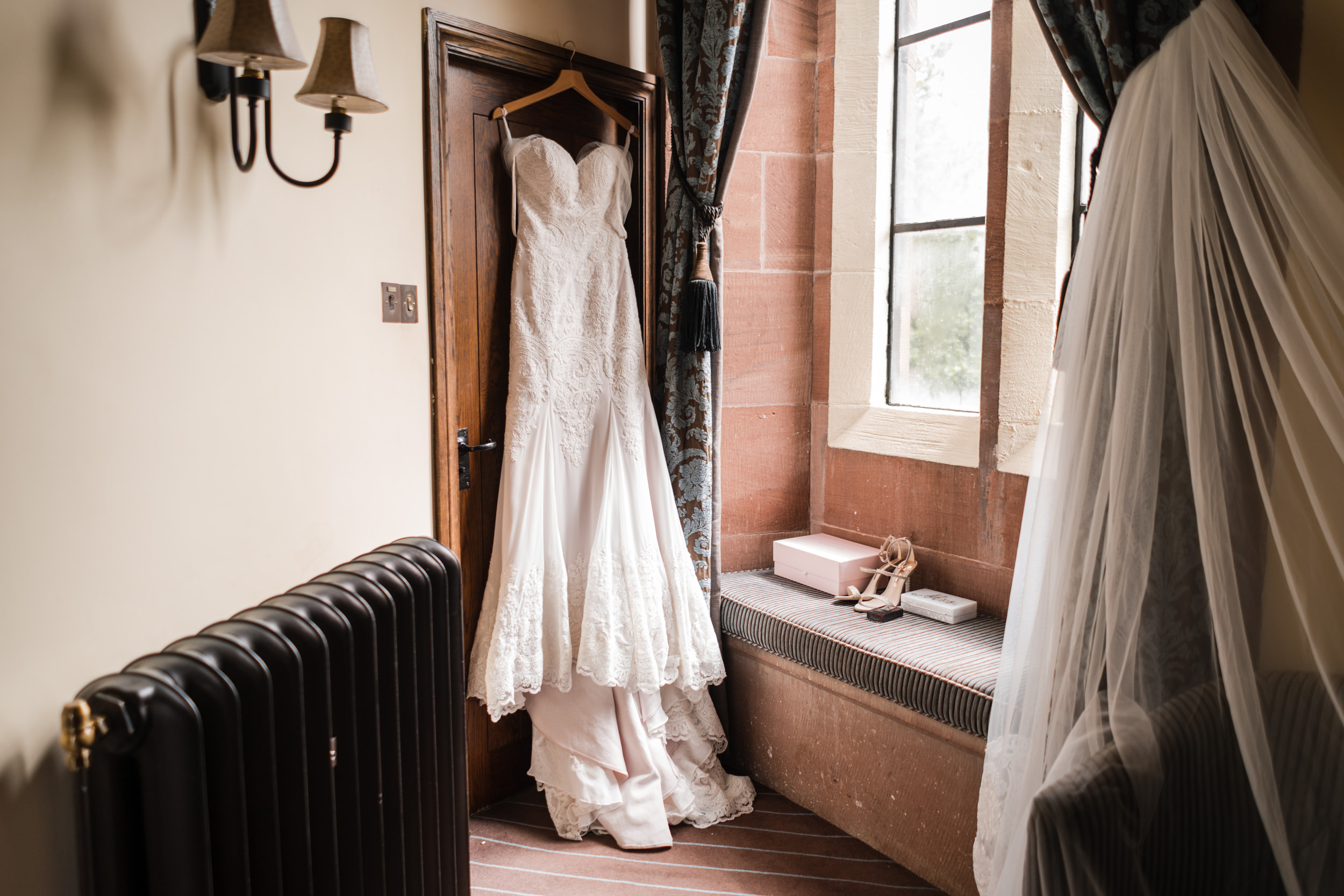Dress hanging in one of Peckforton Castle's rooms