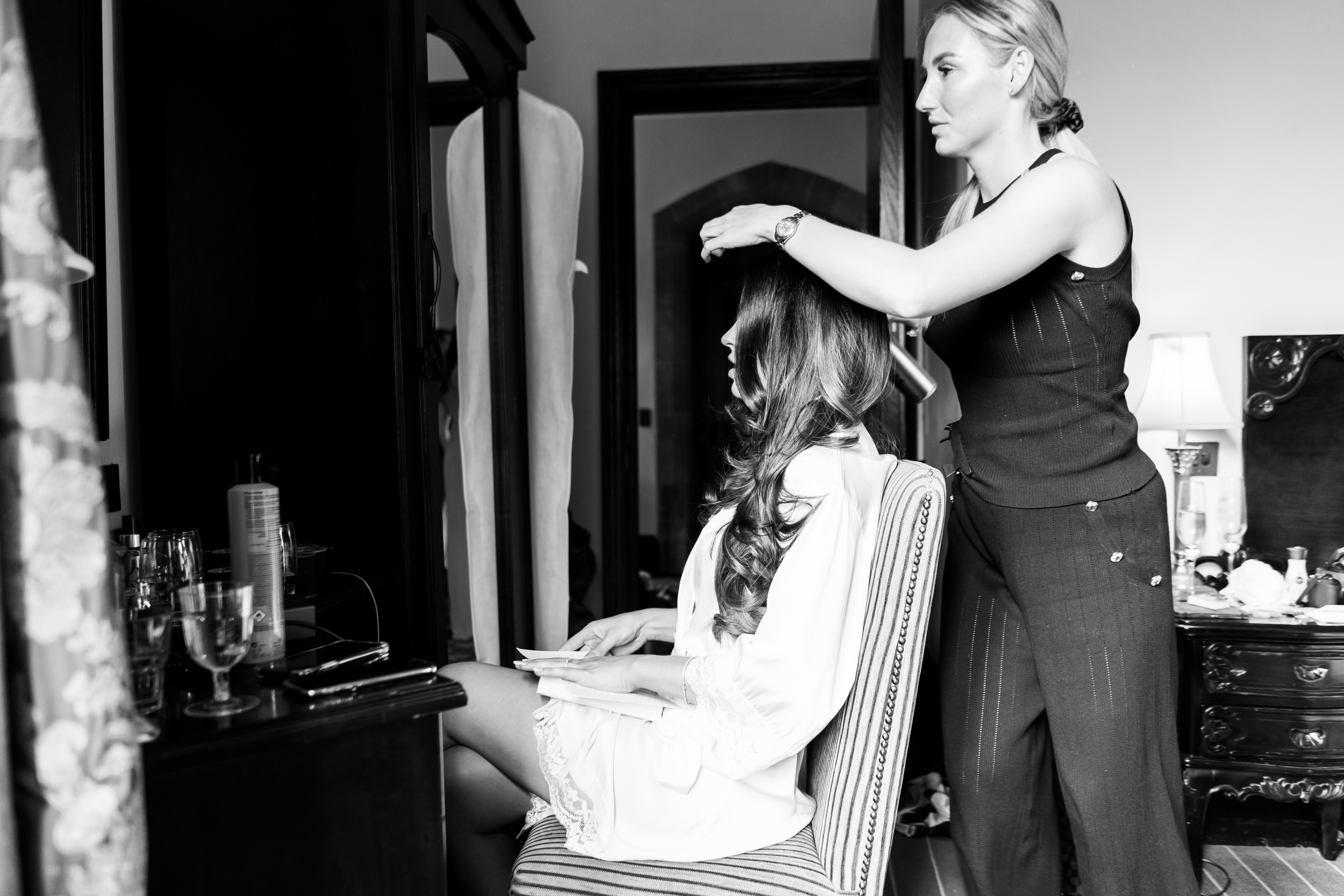 Bride having her hair done at Peckforton Castle