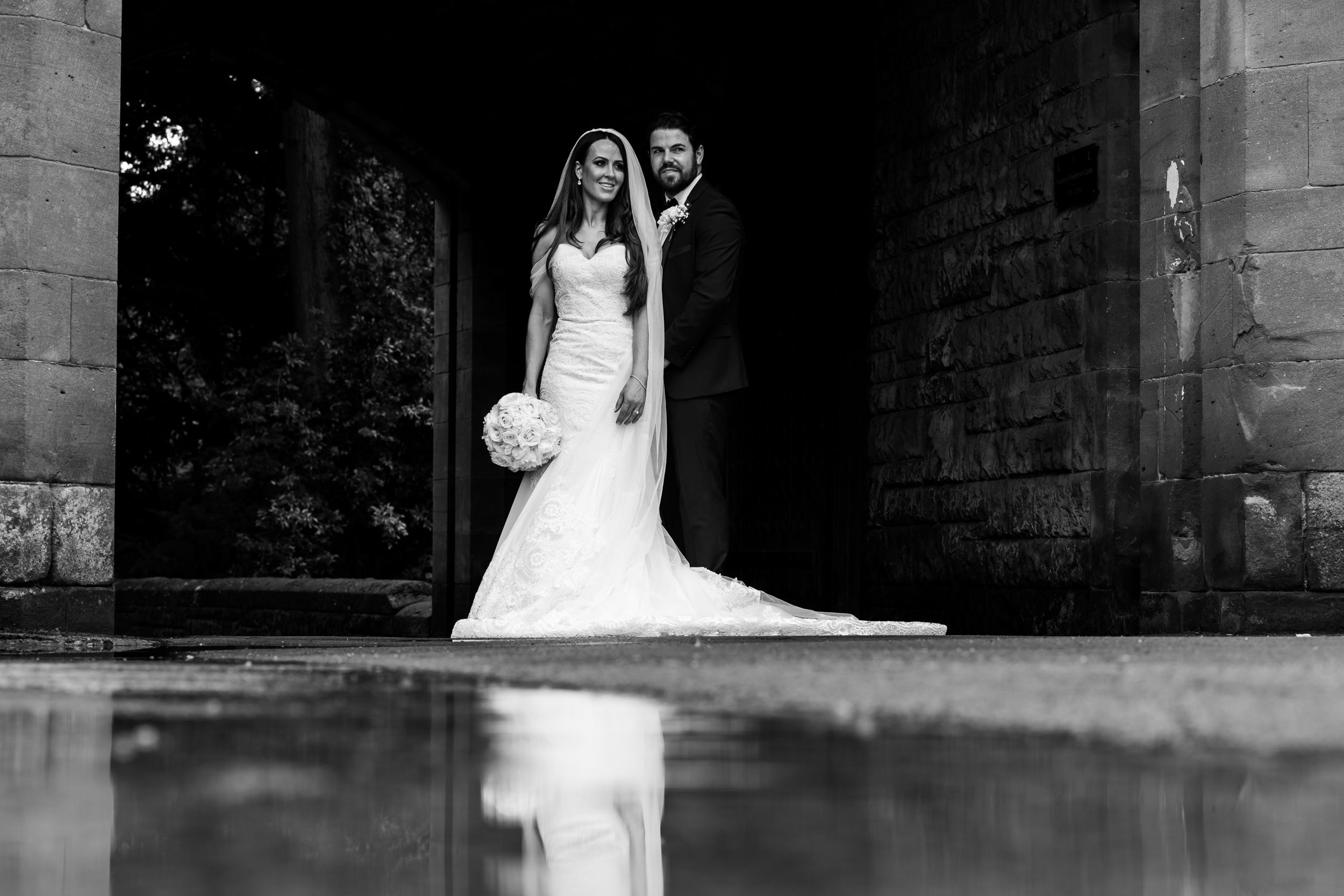 Black and white photograph of the couple at Peckforton Castle