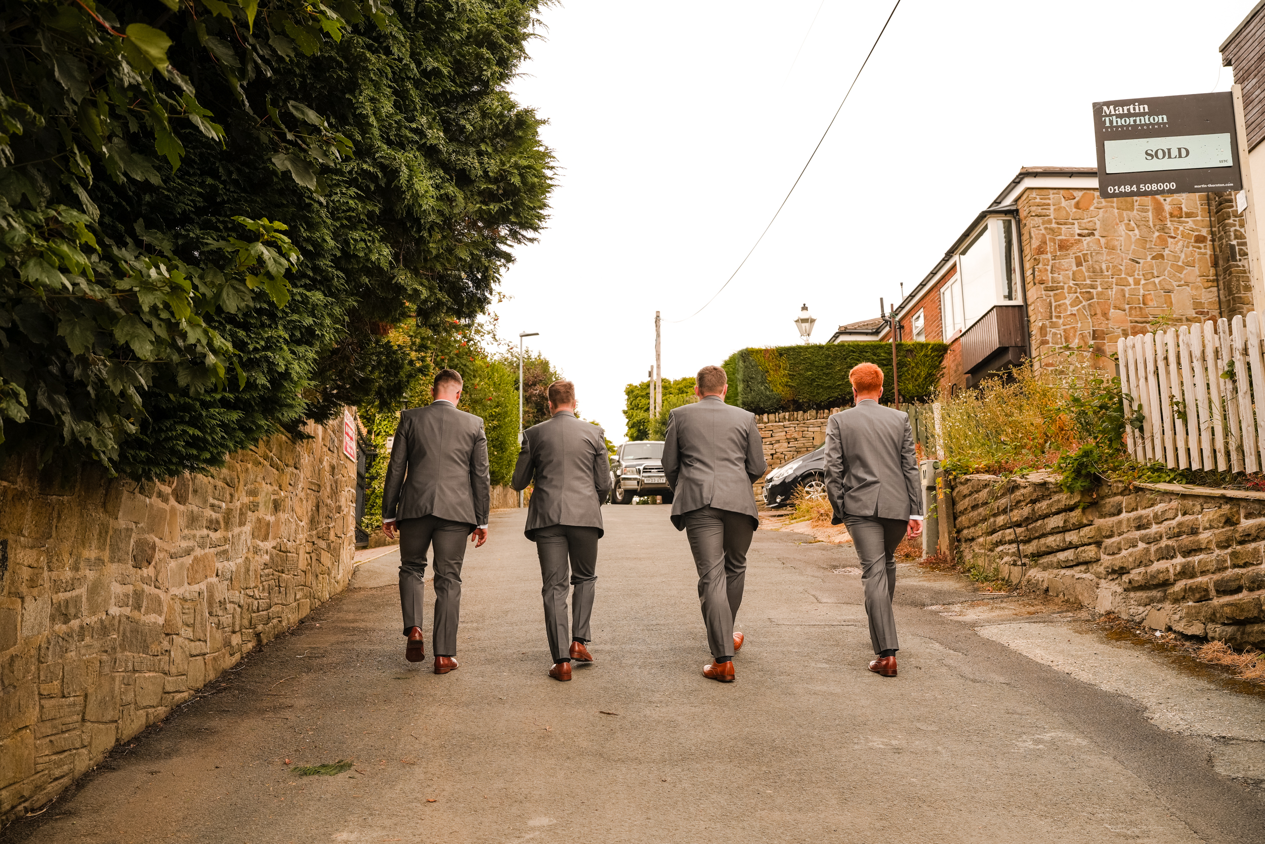 Groom's party walking to the church