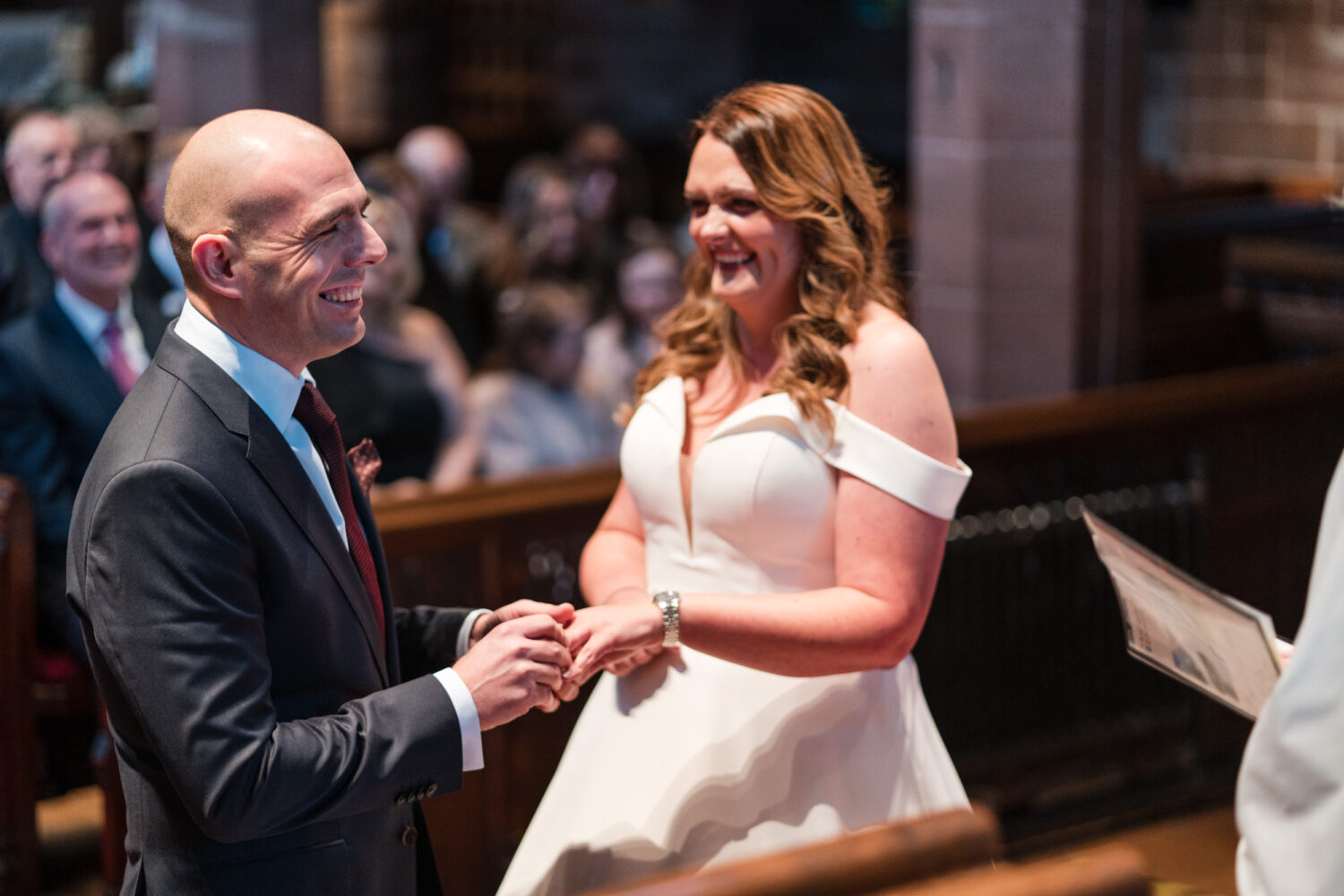 Laughing and exchanging their rings