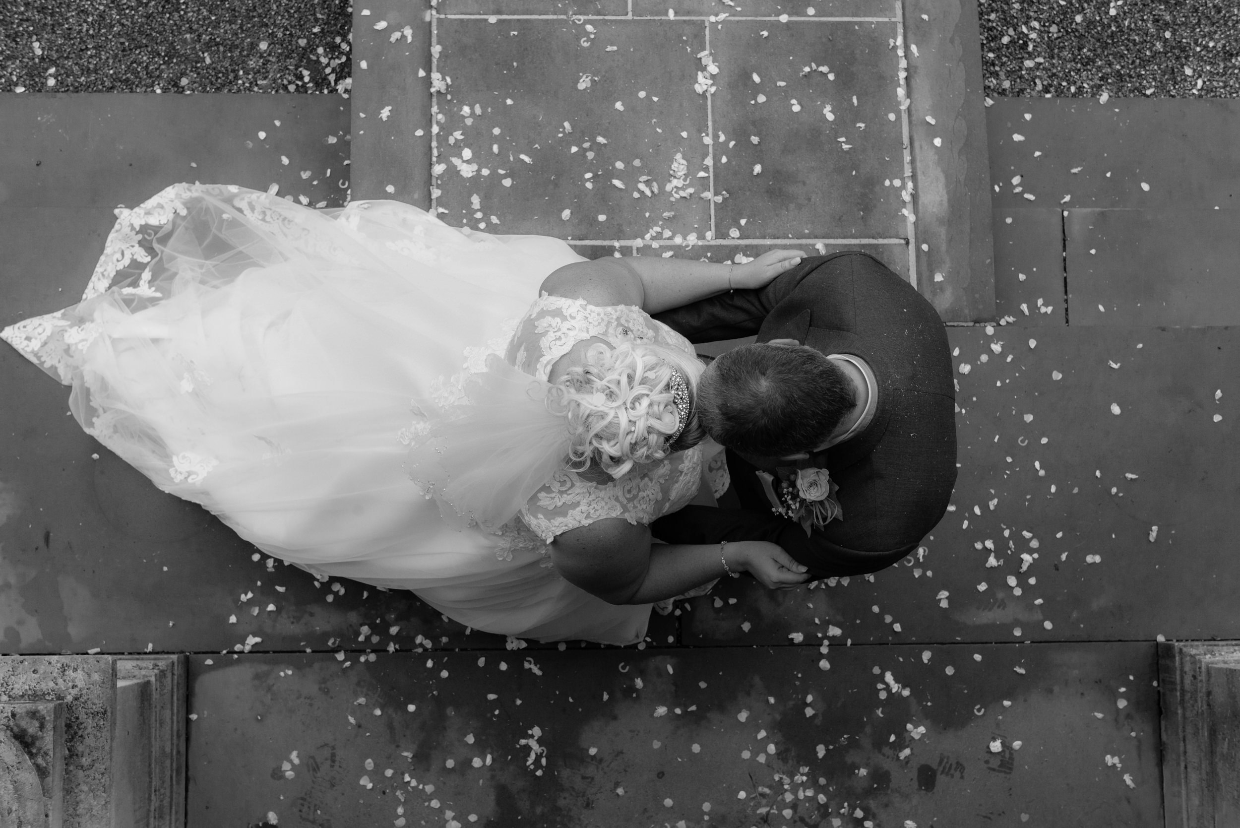 Photo from above of the bride and groom taken from the front balcony at Eaves Hall
