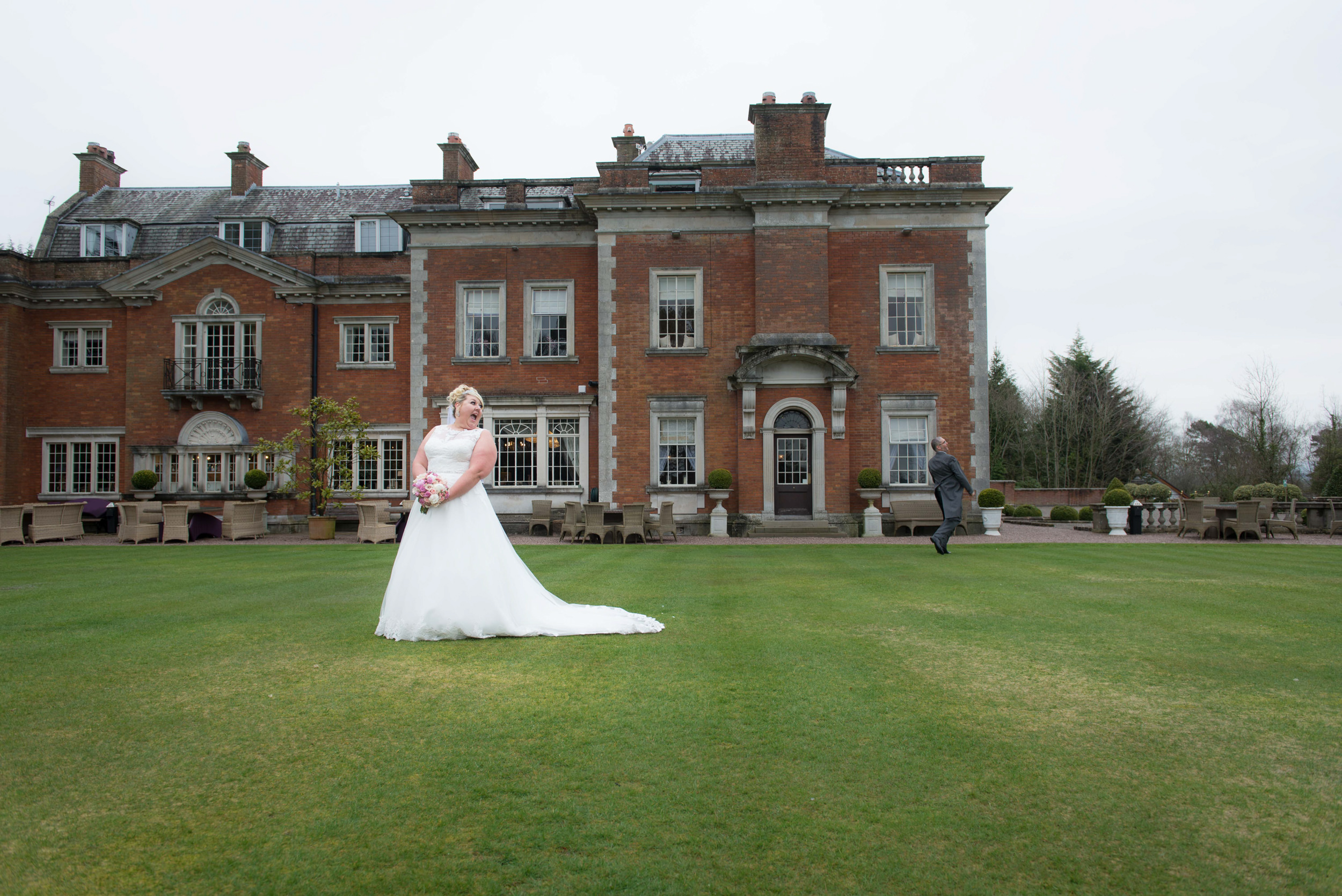 Bride looking back at the groom at Eaves Hall