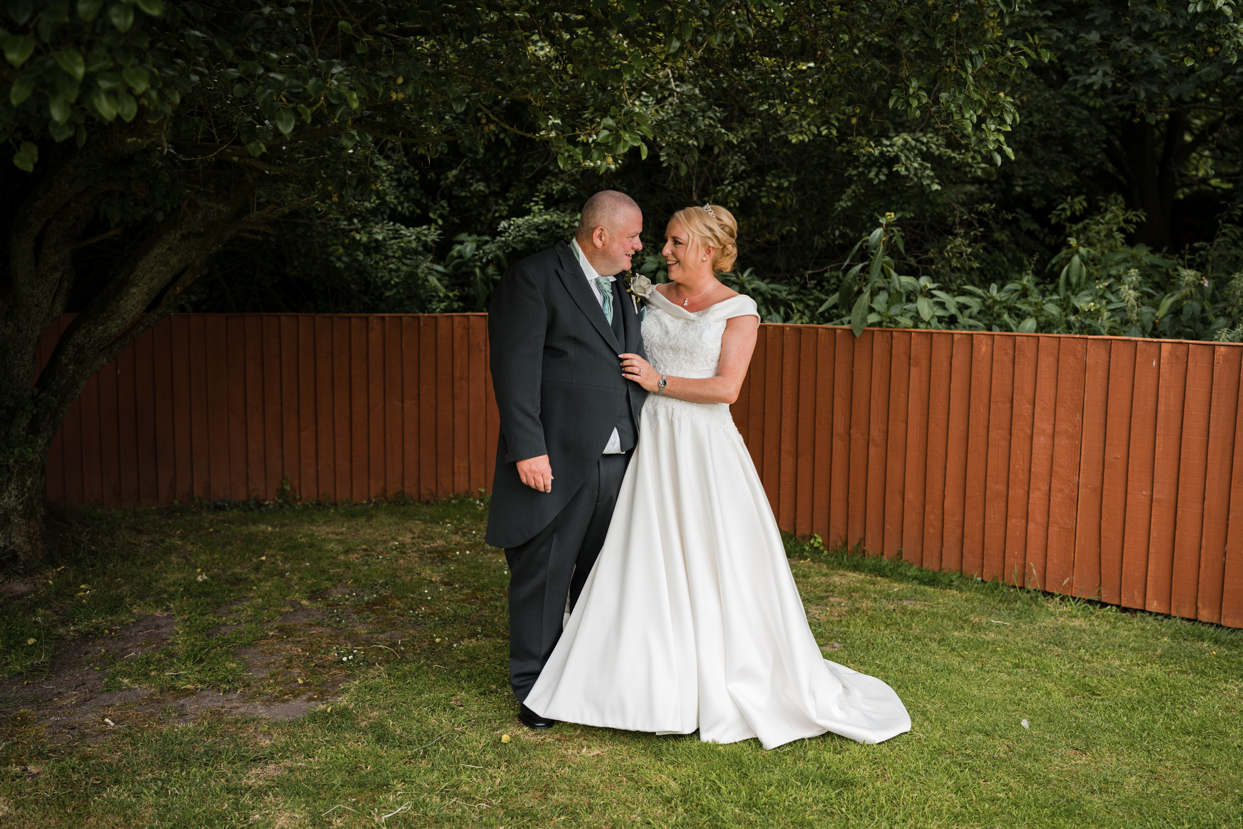 Bride and groom together in the gardens of Briars Hall