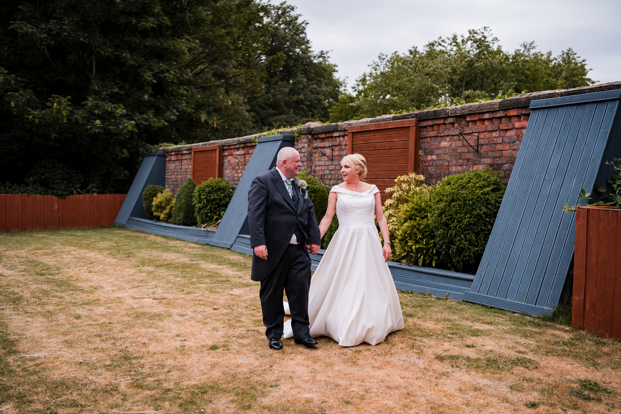 Bride and groom together in the gardens of Briars Hall
