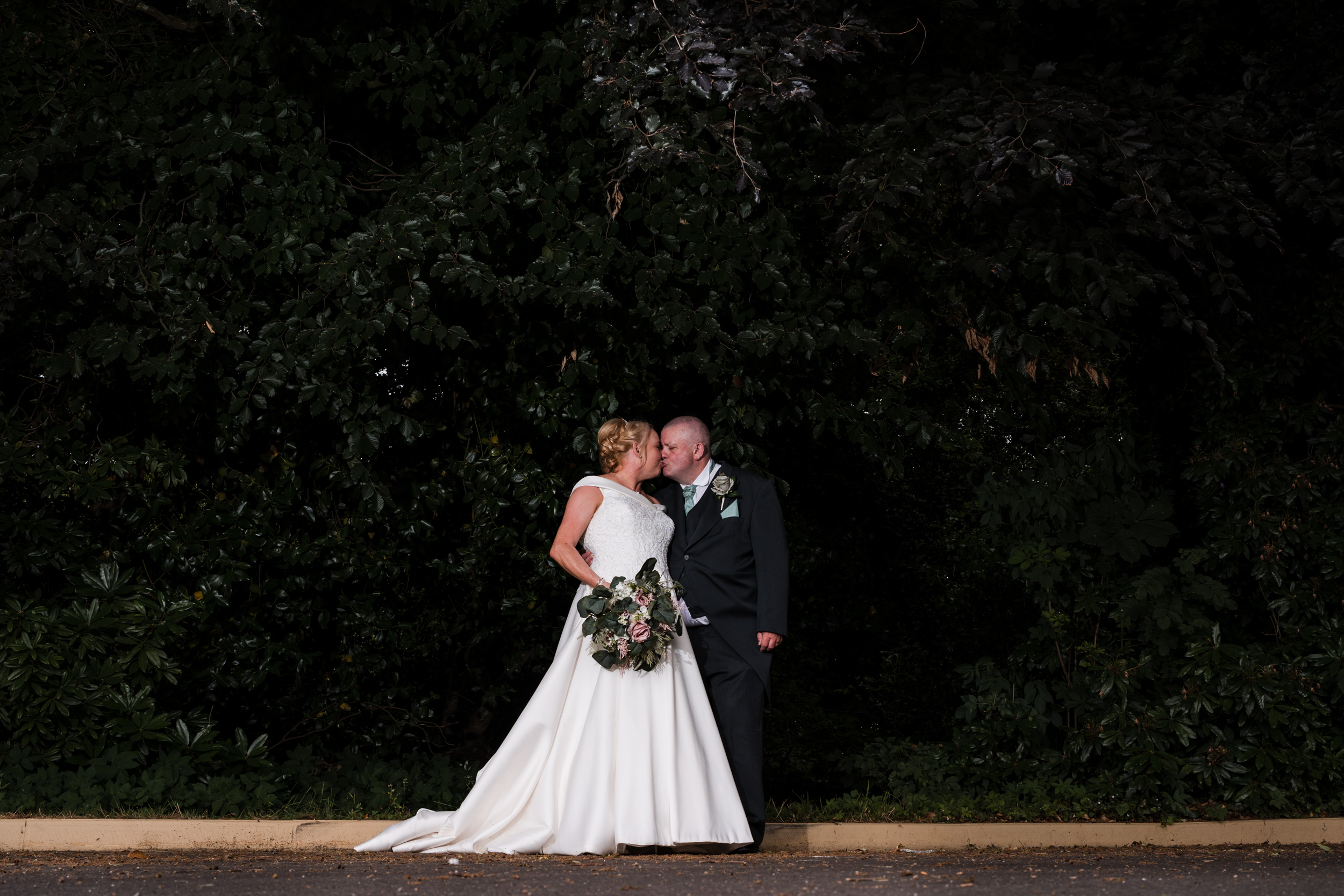 Bride and groom together in the gardens of Briars Hall