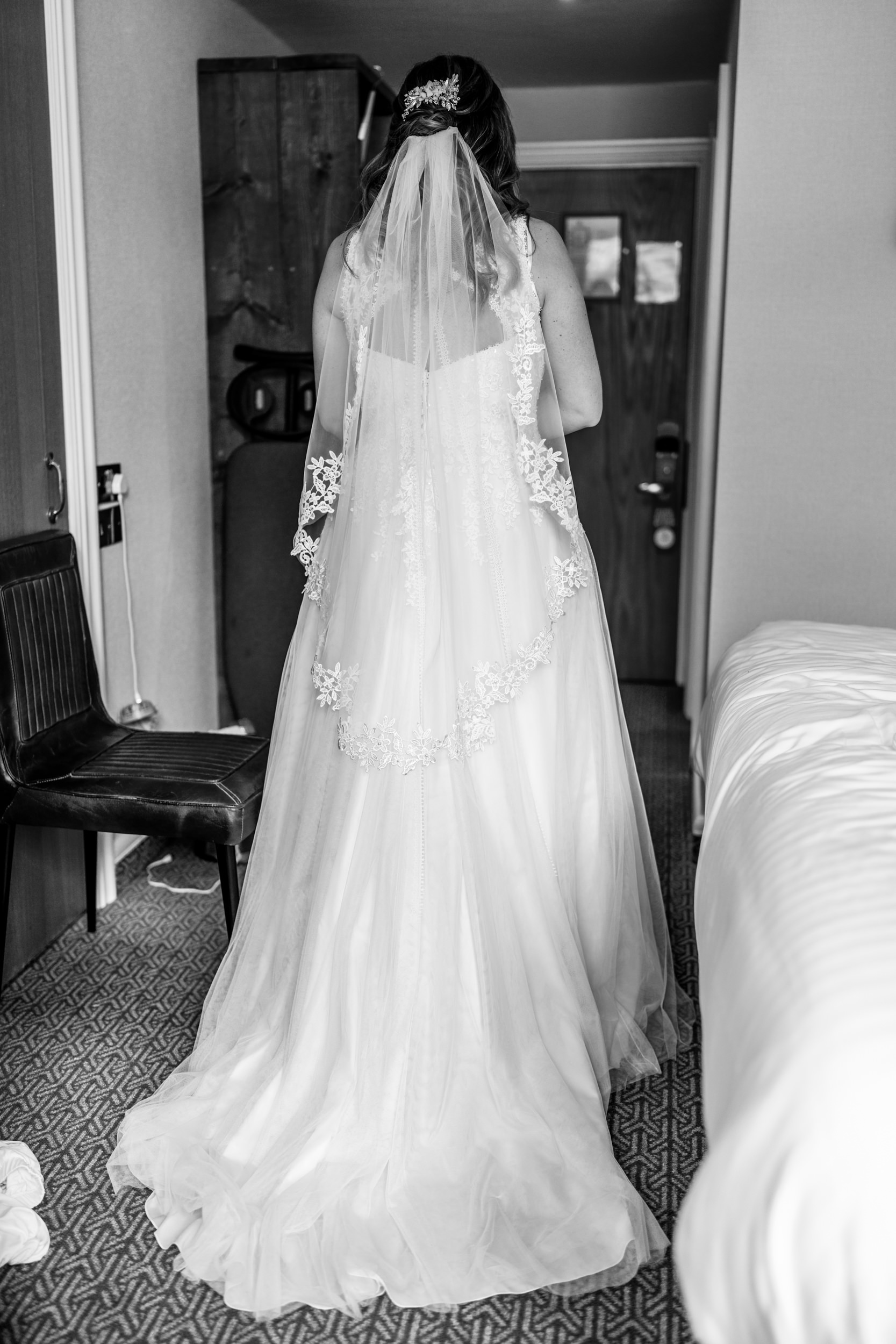 Full length photograph of the bride in her wedding dress. Cedar Court