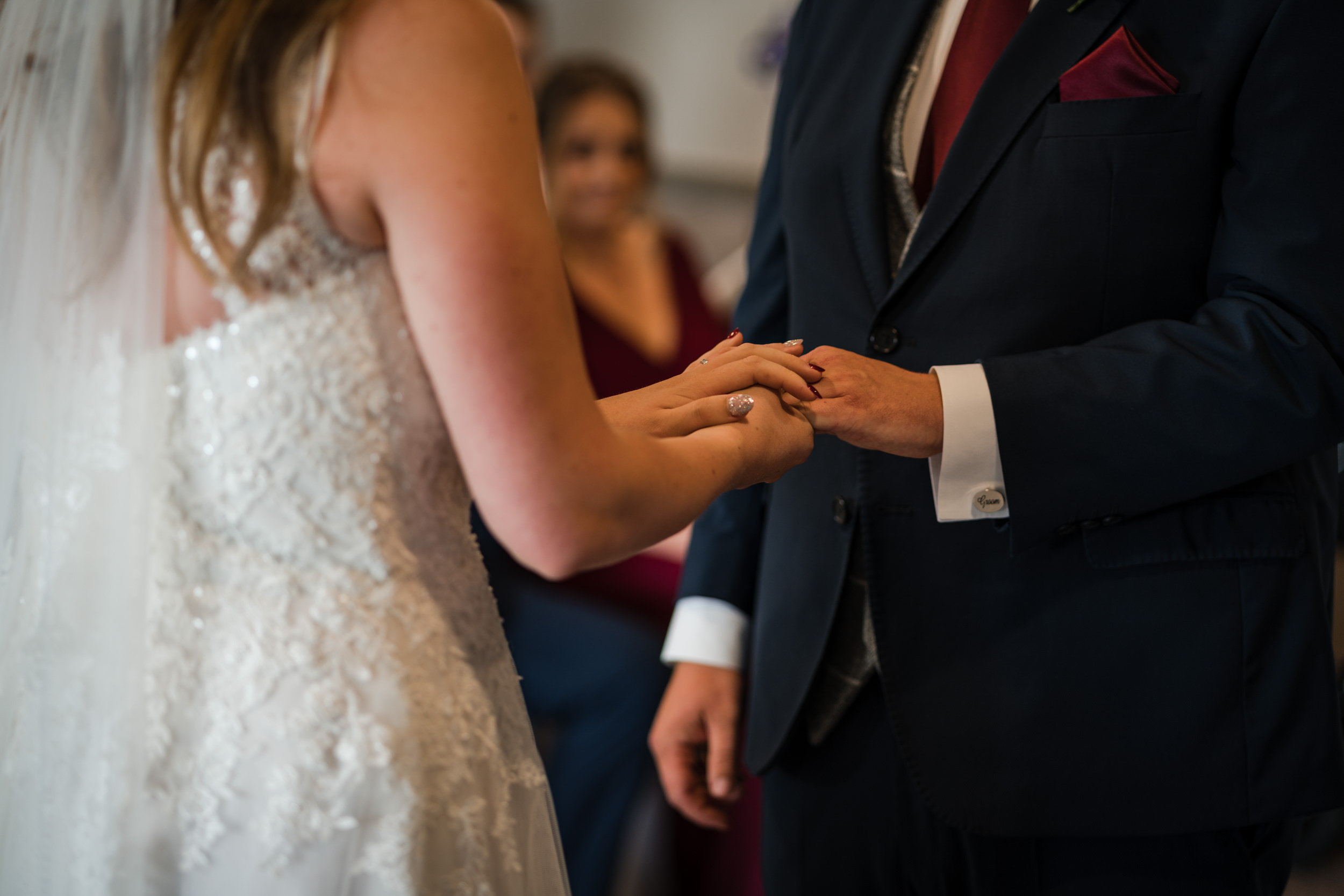 Putting on the wedding ring at Cedar Court
