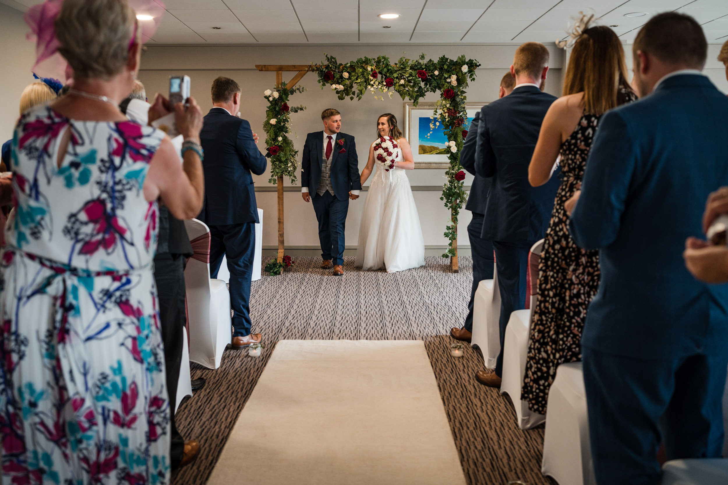 Bride and groom leaving together at Cedar Court
