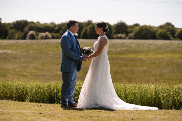 Bride and groom looking at each other during their spring wedding at Norton Grange