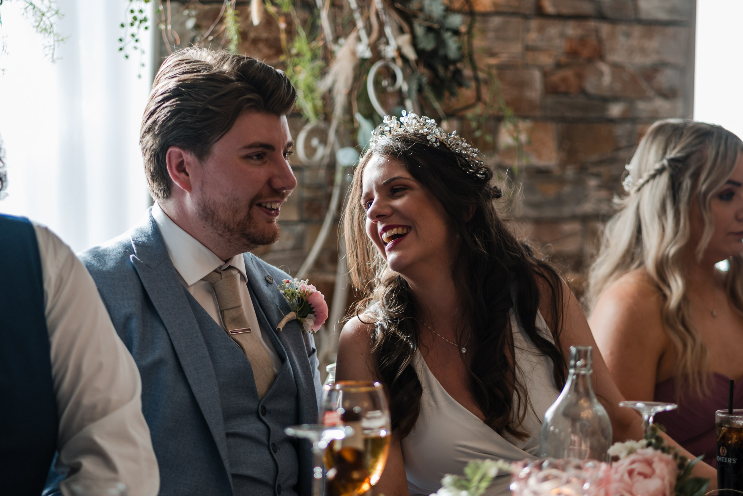 Bride smiling at groom