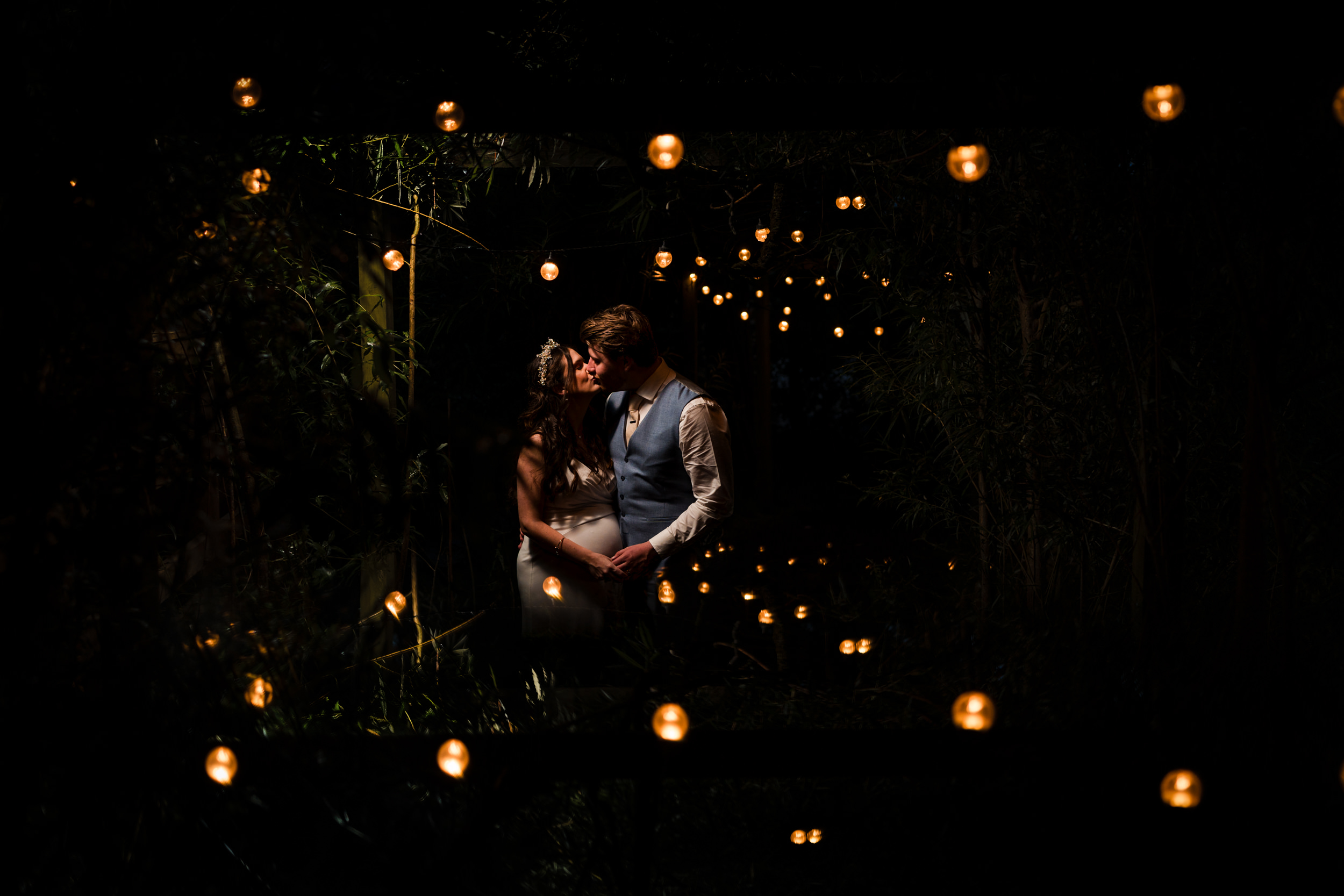 Evening OCF portrait of the couple in the walkway outside Grains Bar Hotel