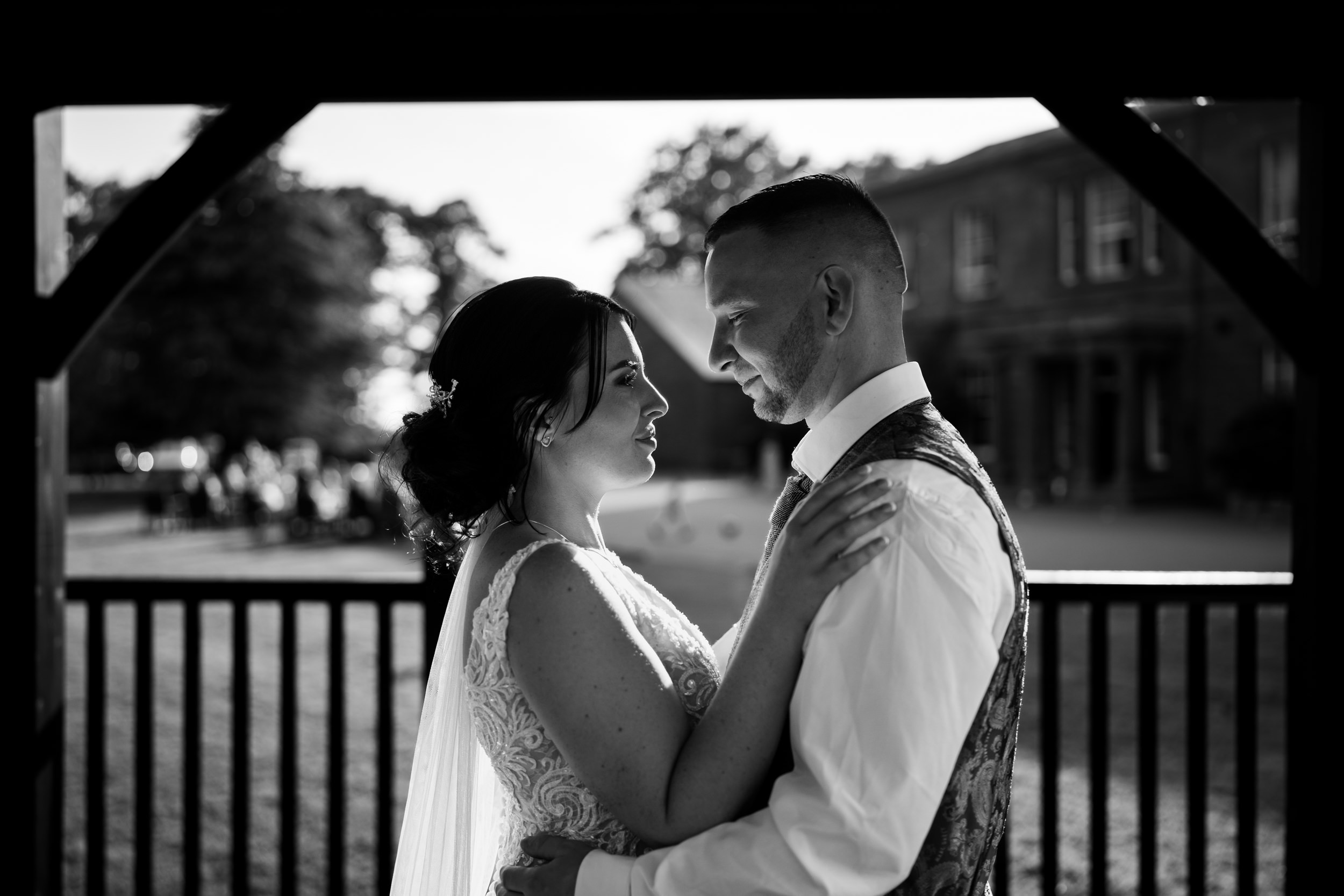 Mono photograph of the bride and groom looking at each other outside the Greenhill Hotel