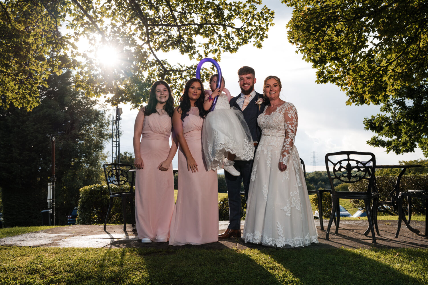 Family stood together outside Norton Grange