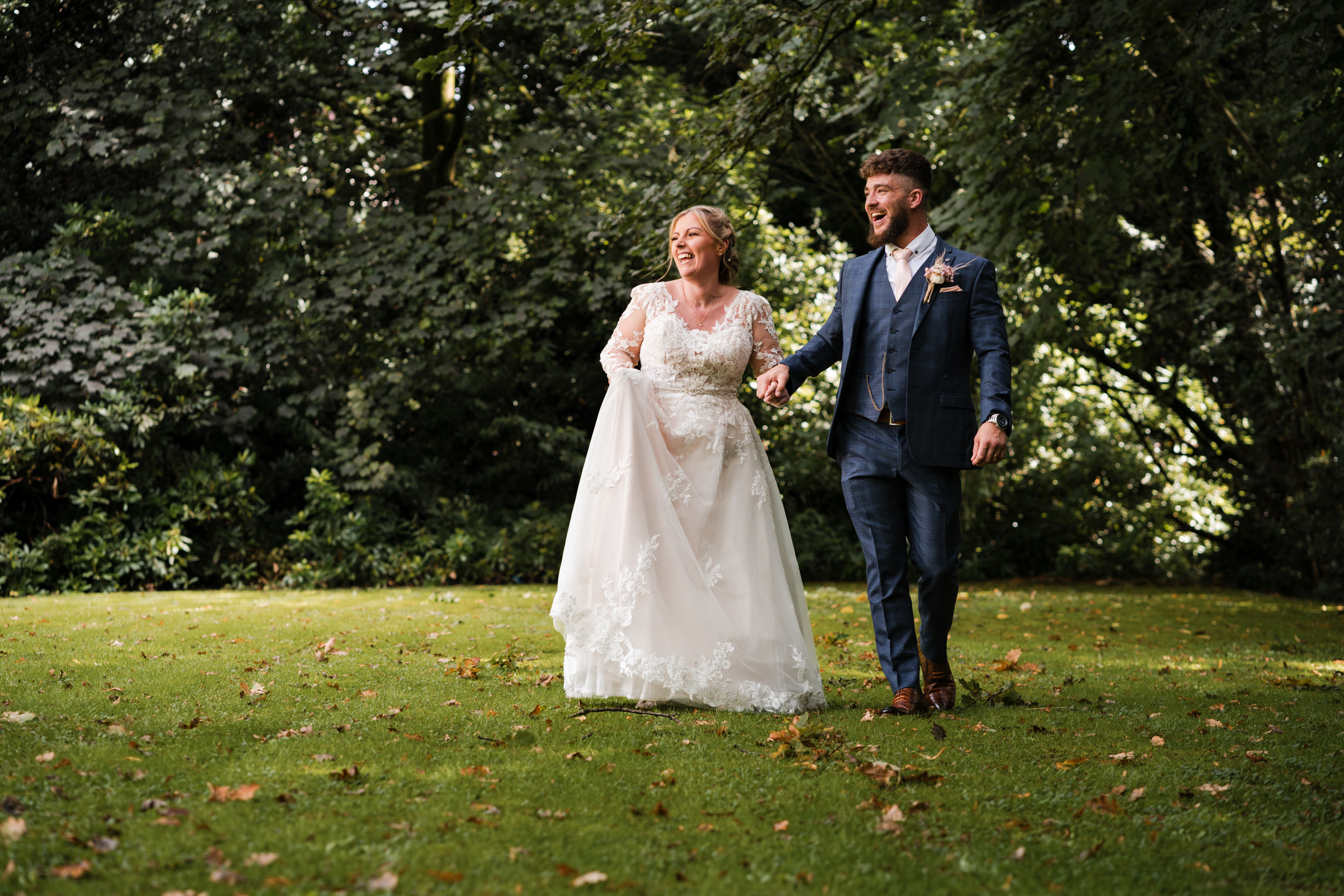 Couple walking together for portraits at Norton Grange