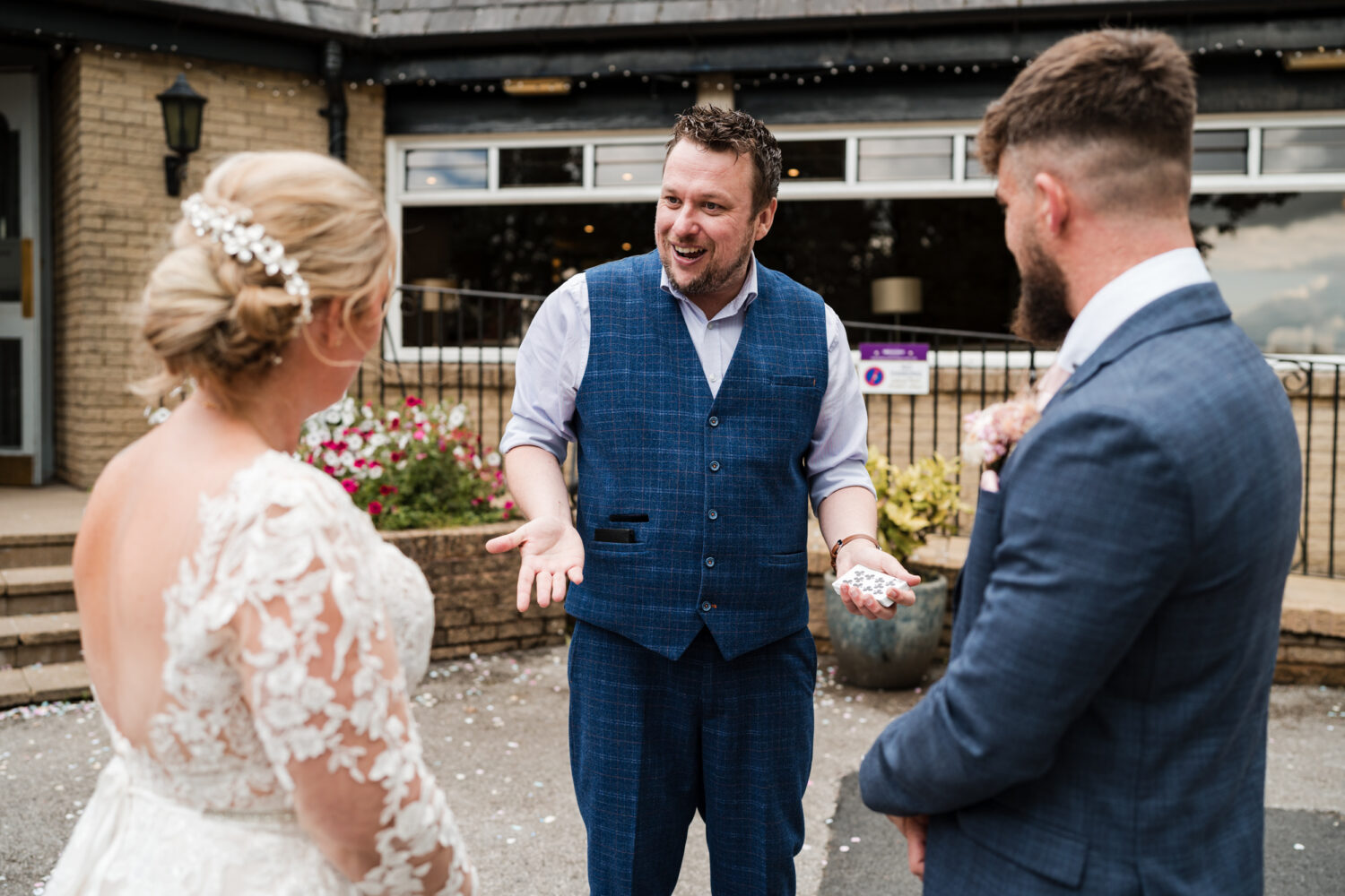 Bride and groom watching the magician at Norton Grange.