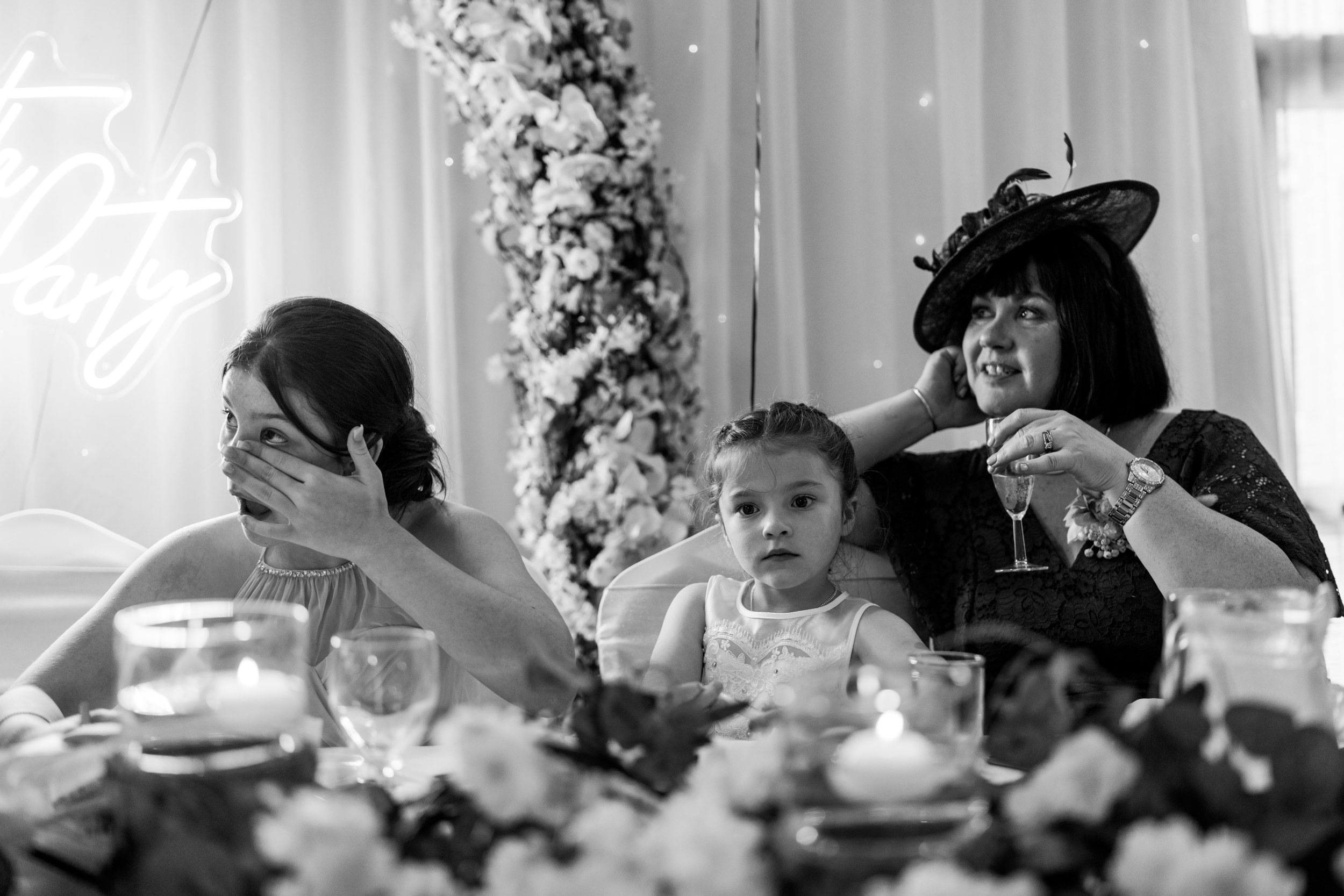Bridesmaid wiping away a tear at Norton Grange.