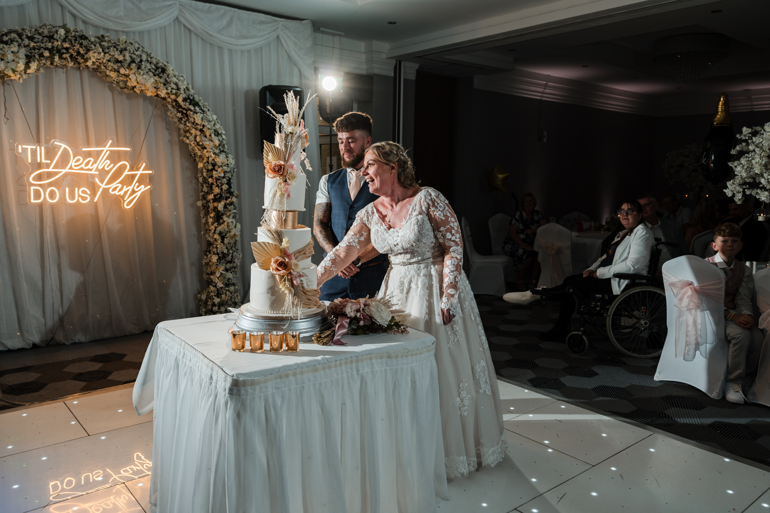 Bride and groom cutting their cake