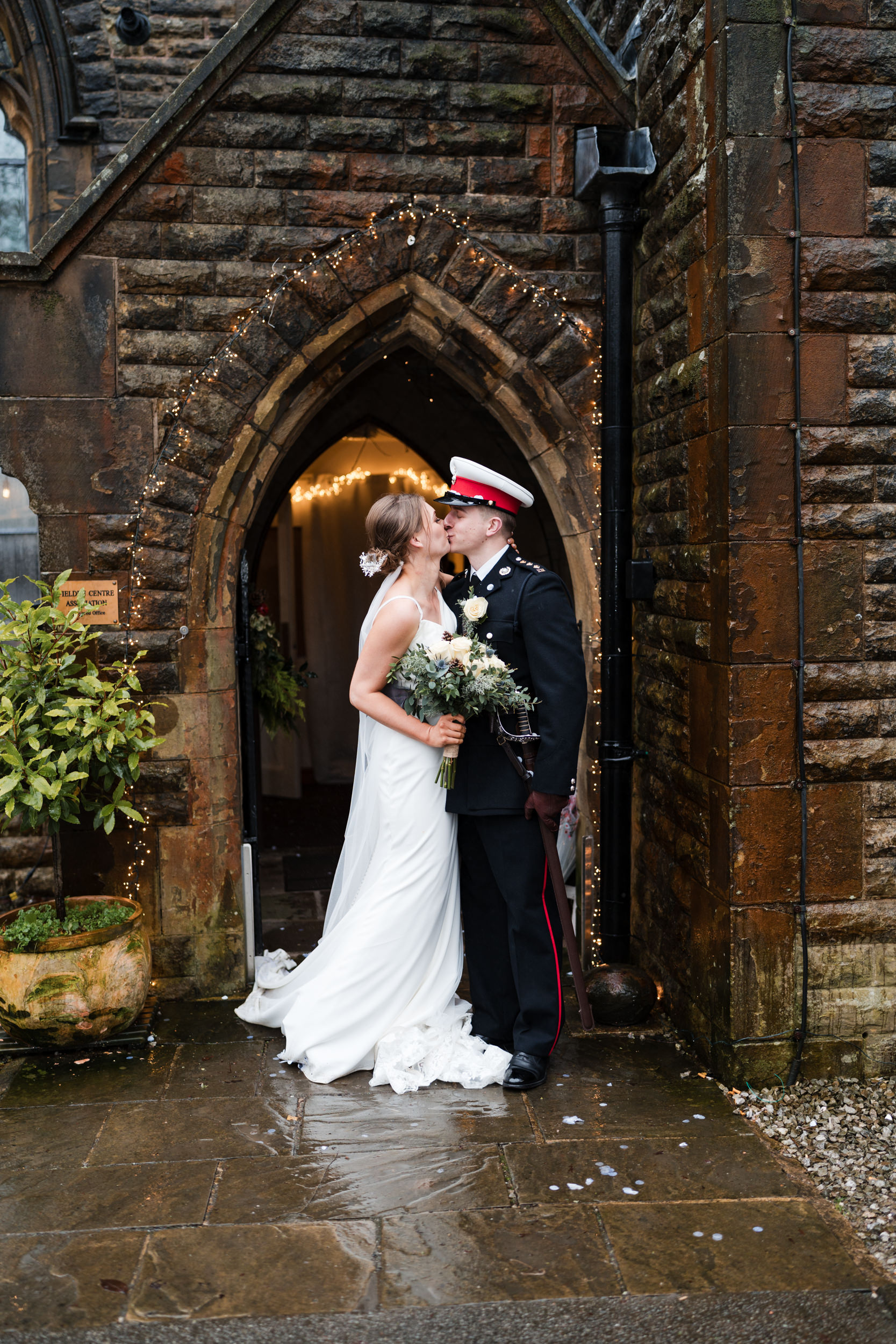 Couple kissing outside Fielden Hall