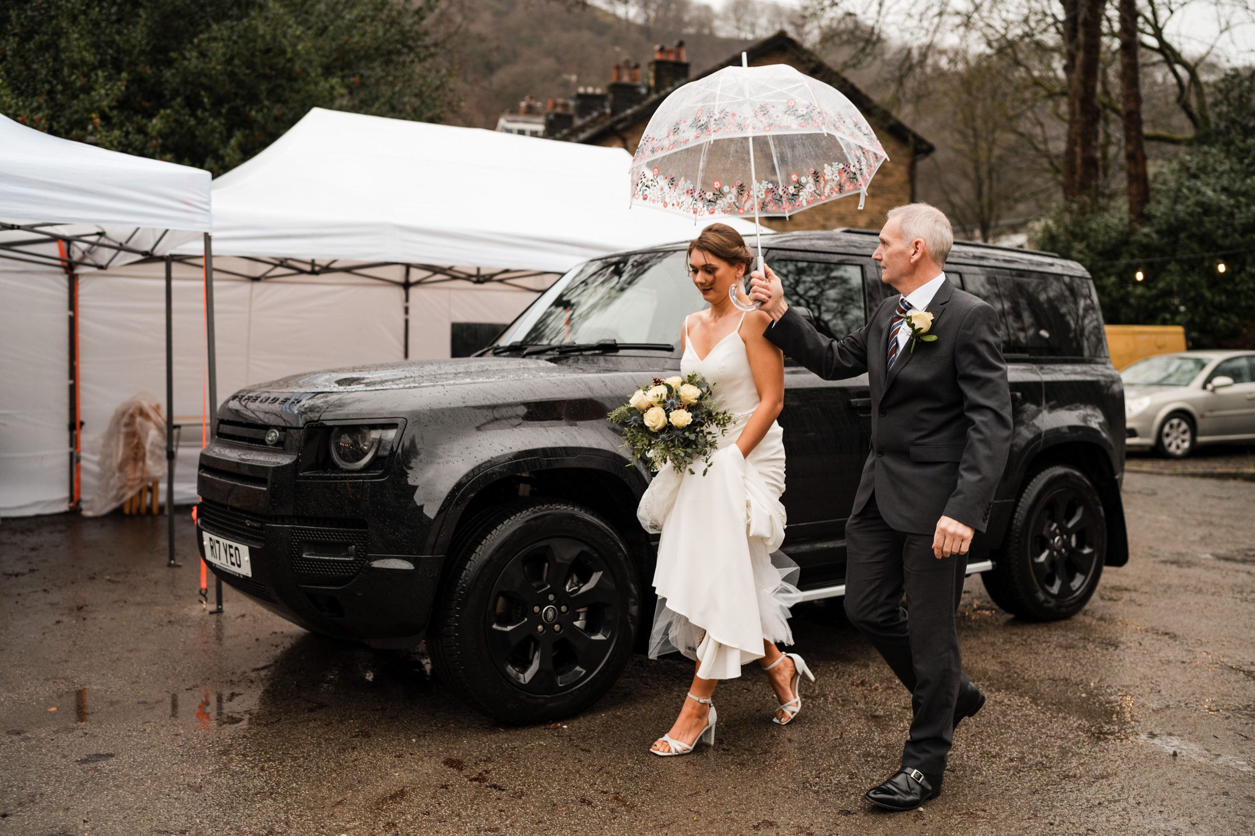 Bride's father escorting her into Fielden Hall