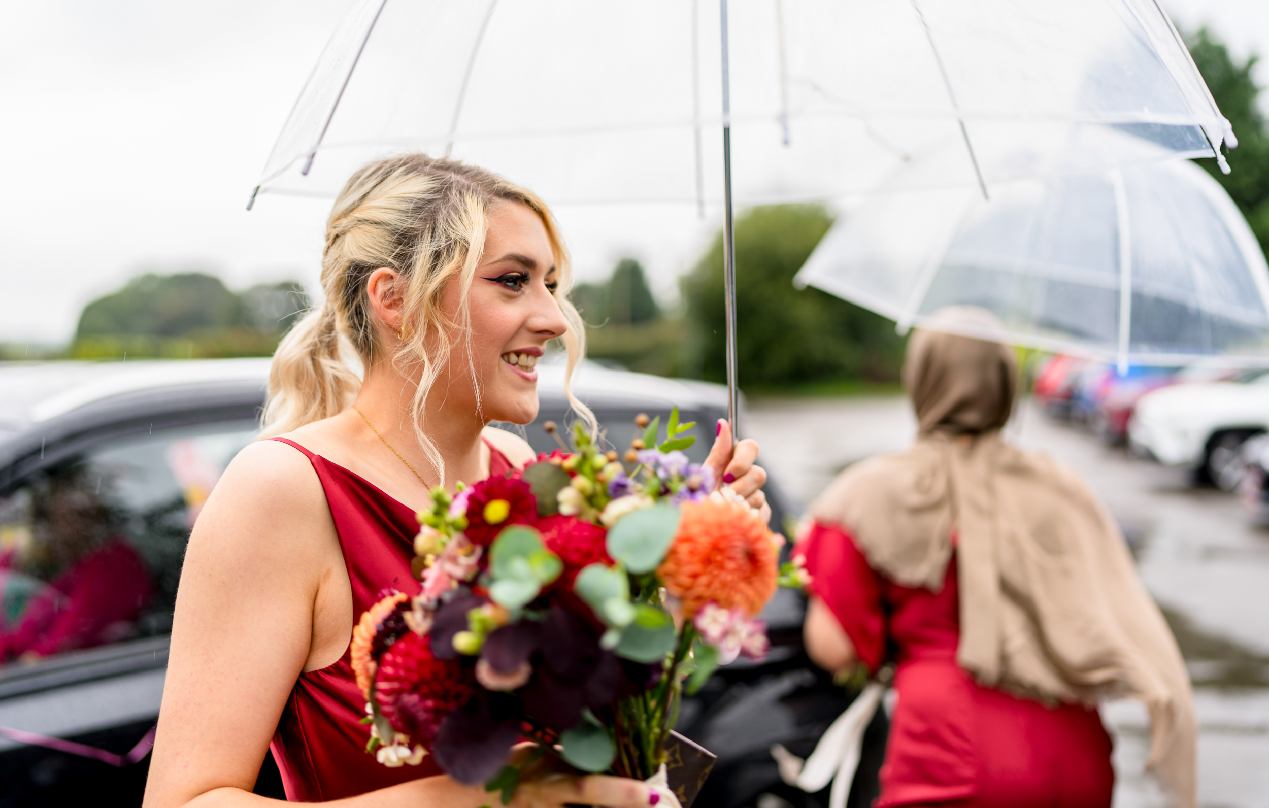 Bridesmaid with an umbrella