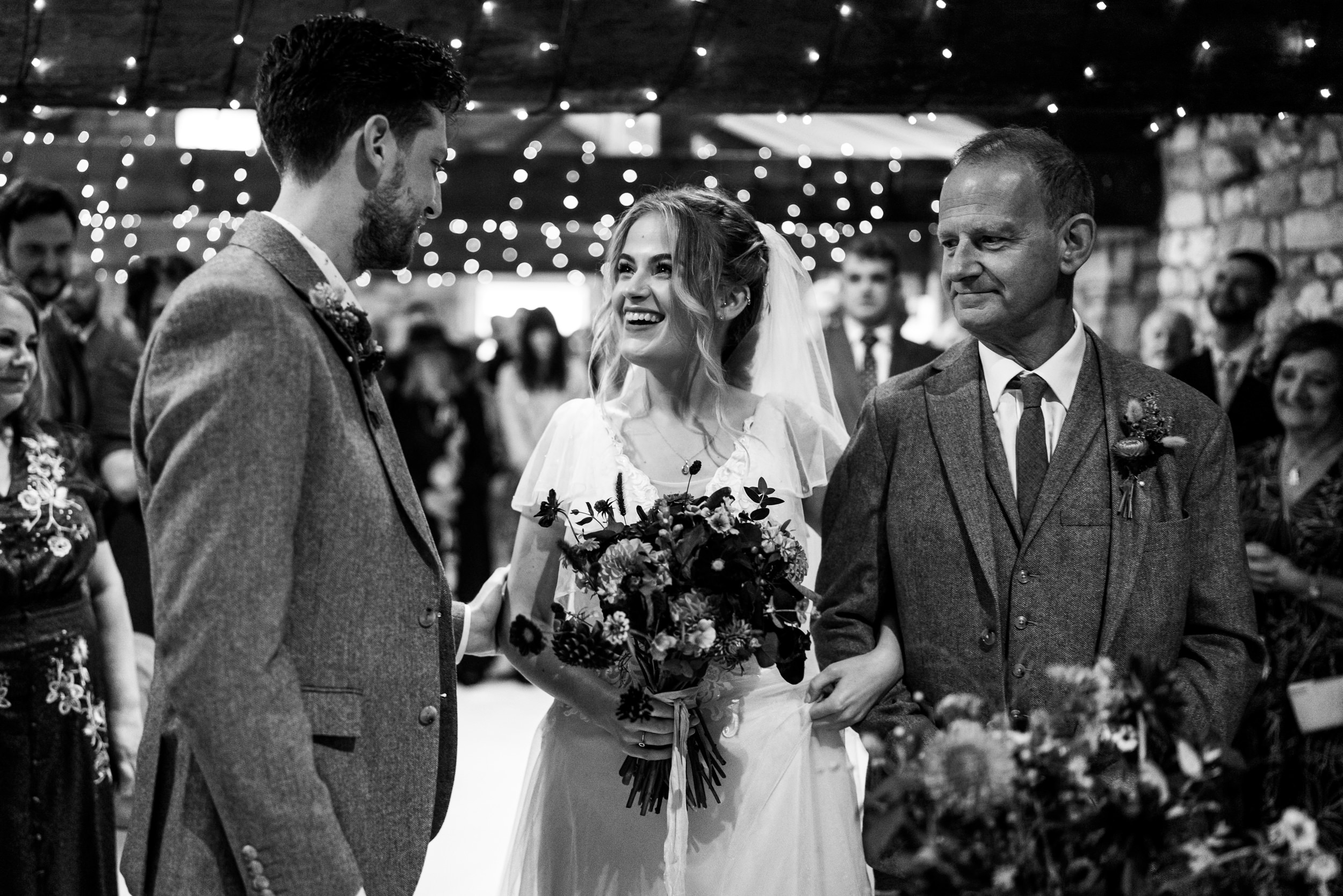 Bride walking down the aisle with her dad at the Old Barn, Esholt