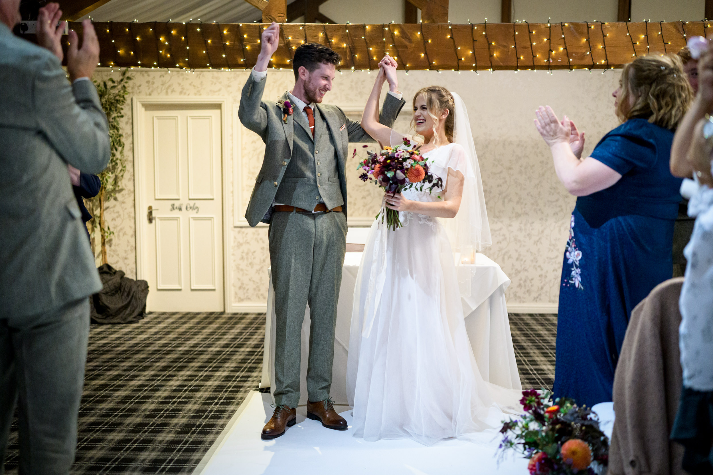 Newly married couple walking down the aisle together
