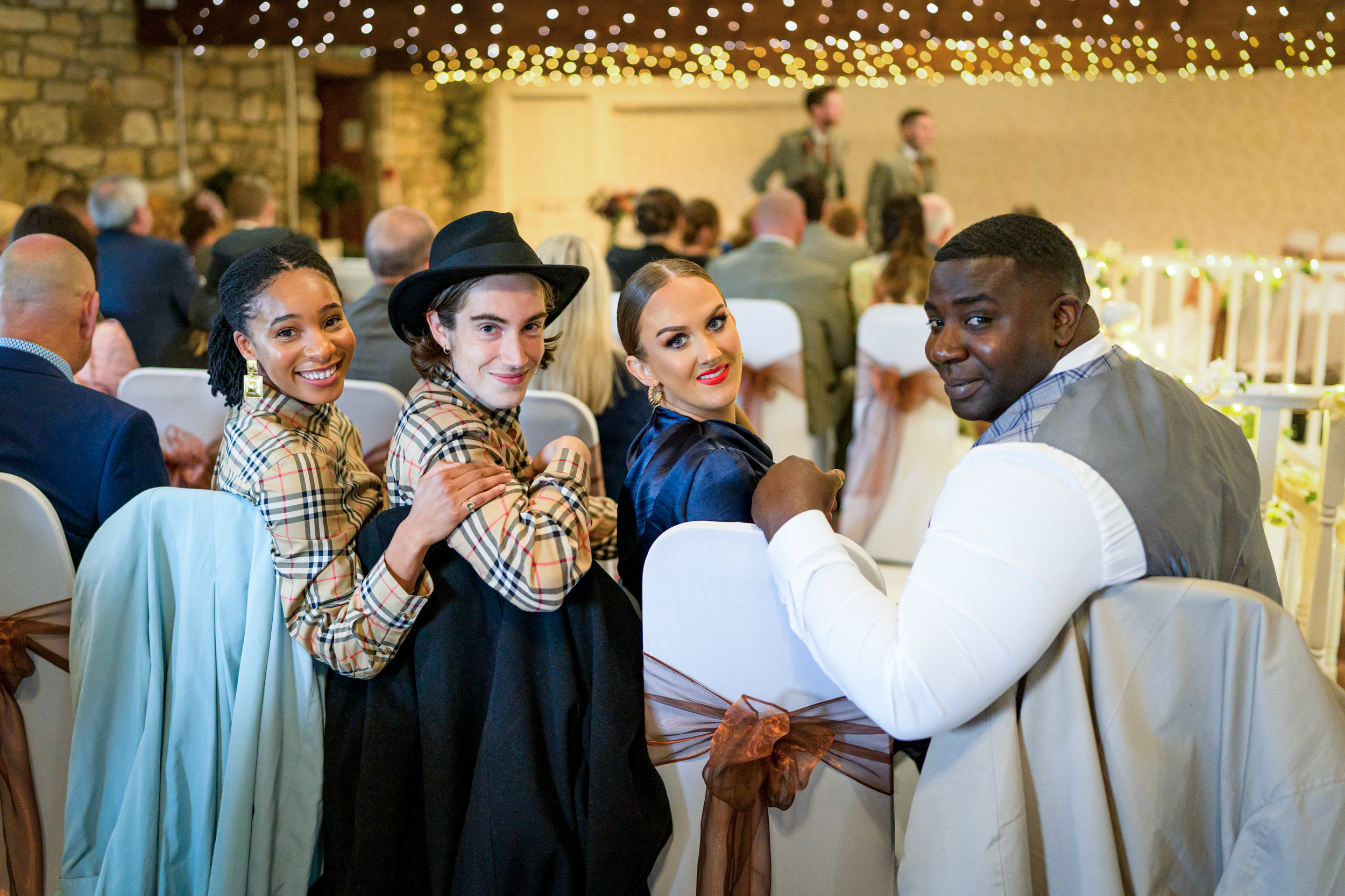 A line of guests looking back at the camera