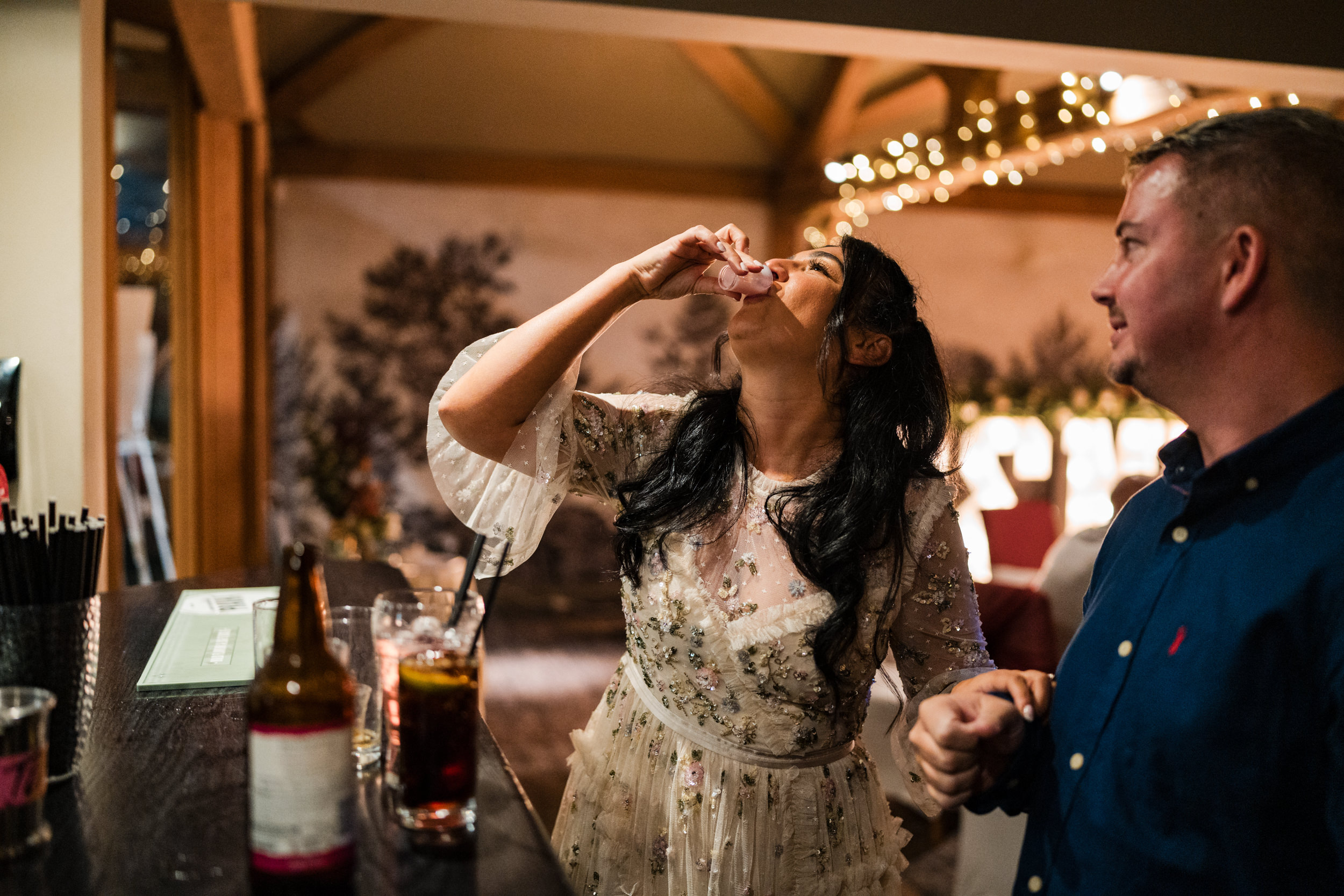 Bride drinking shots at the White Hart Inn, Lydgate.