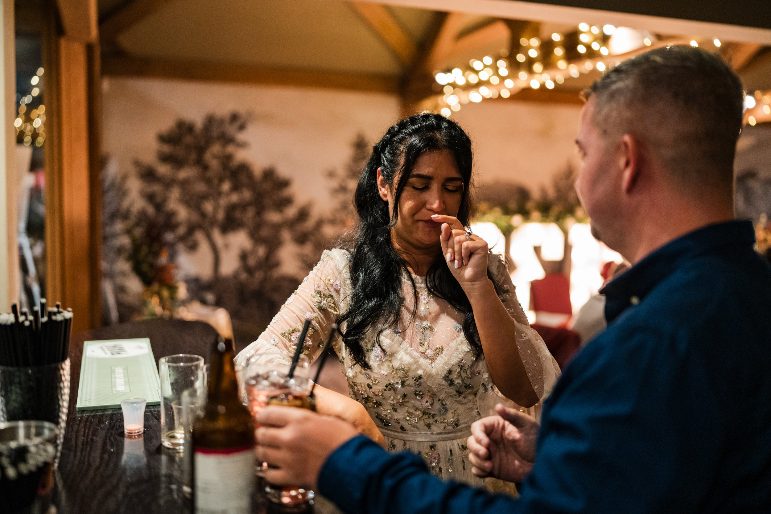 Bride drinking shots at the White Hart Inn, Lydgate.