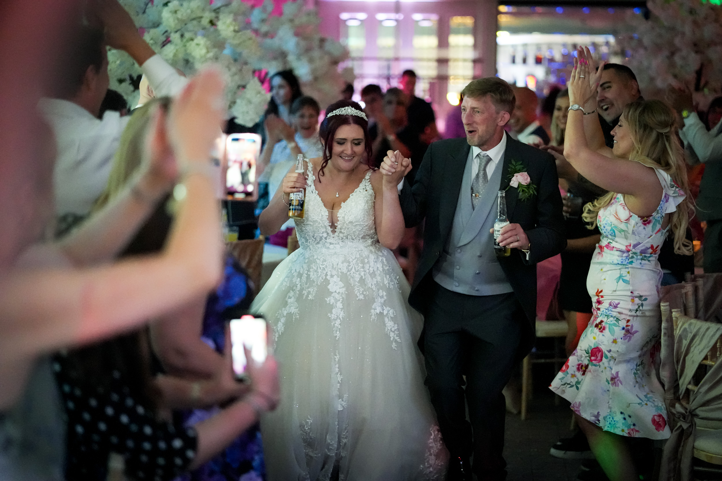 Couple walking to the dancefloor at Mottram Hall