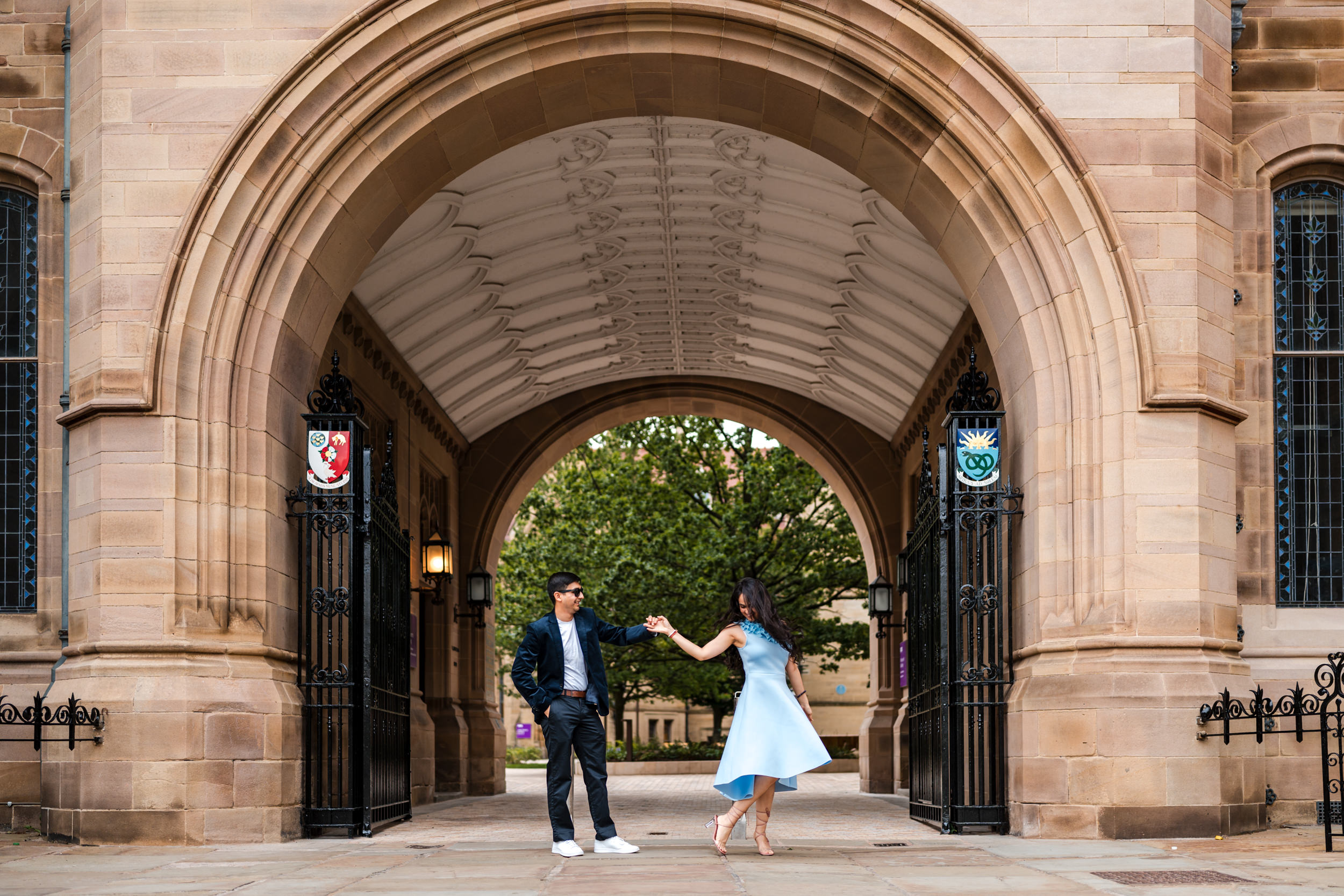 Couple dancing in the Queen's Arch at the University of Manchester. 