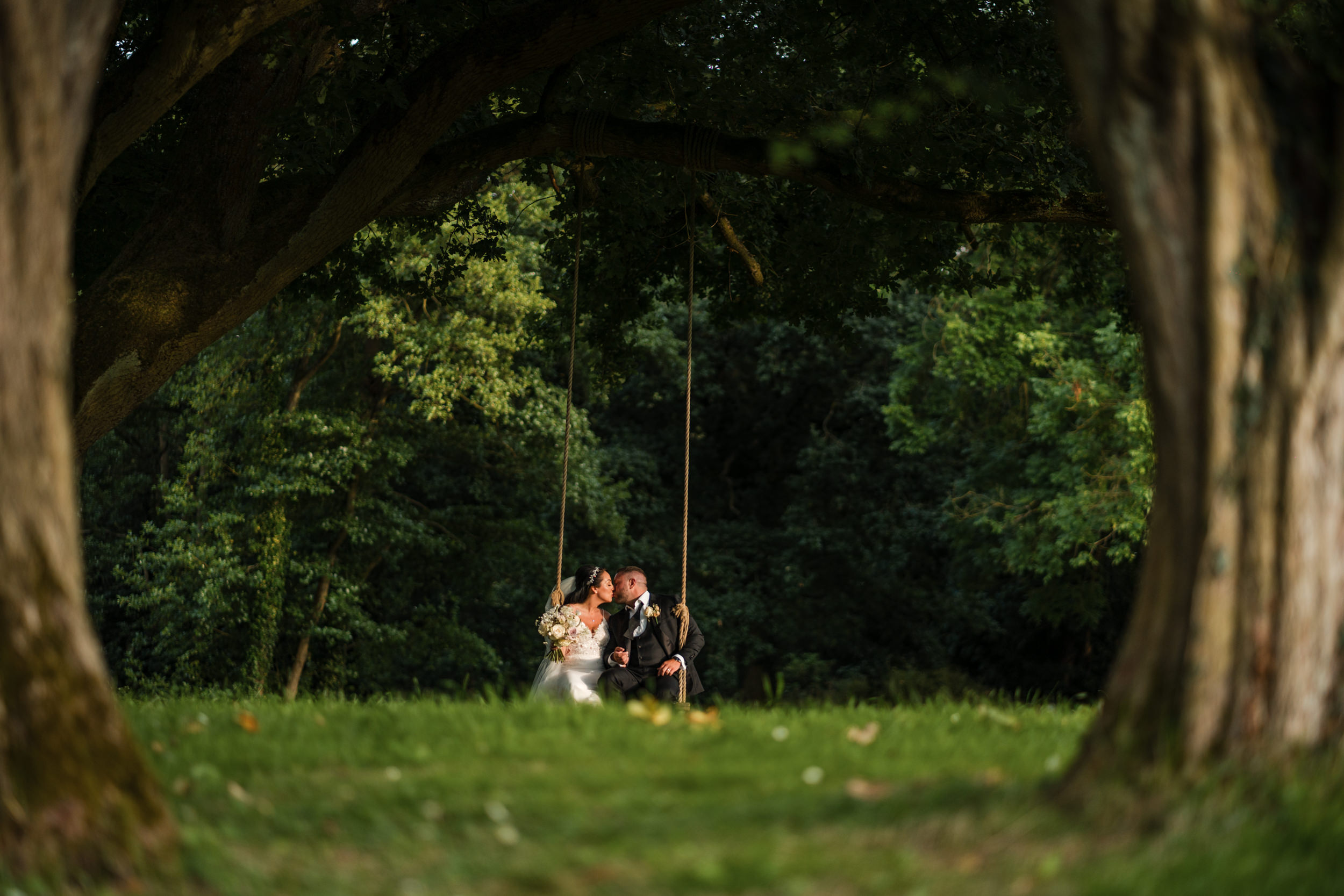 Bride and groom on the swing at Thicket Priory, York