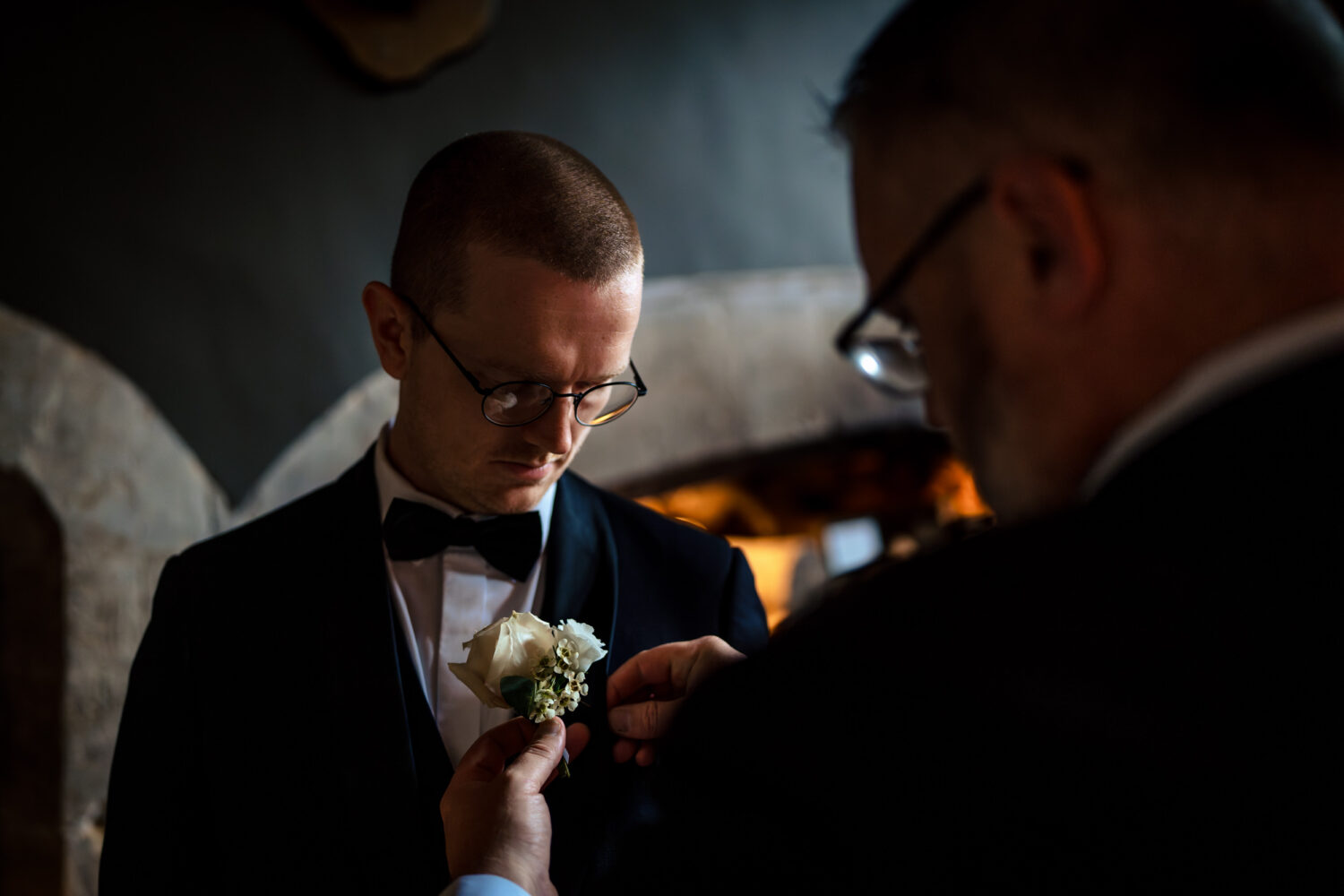 Buttonholes being attached at Howsham Hall