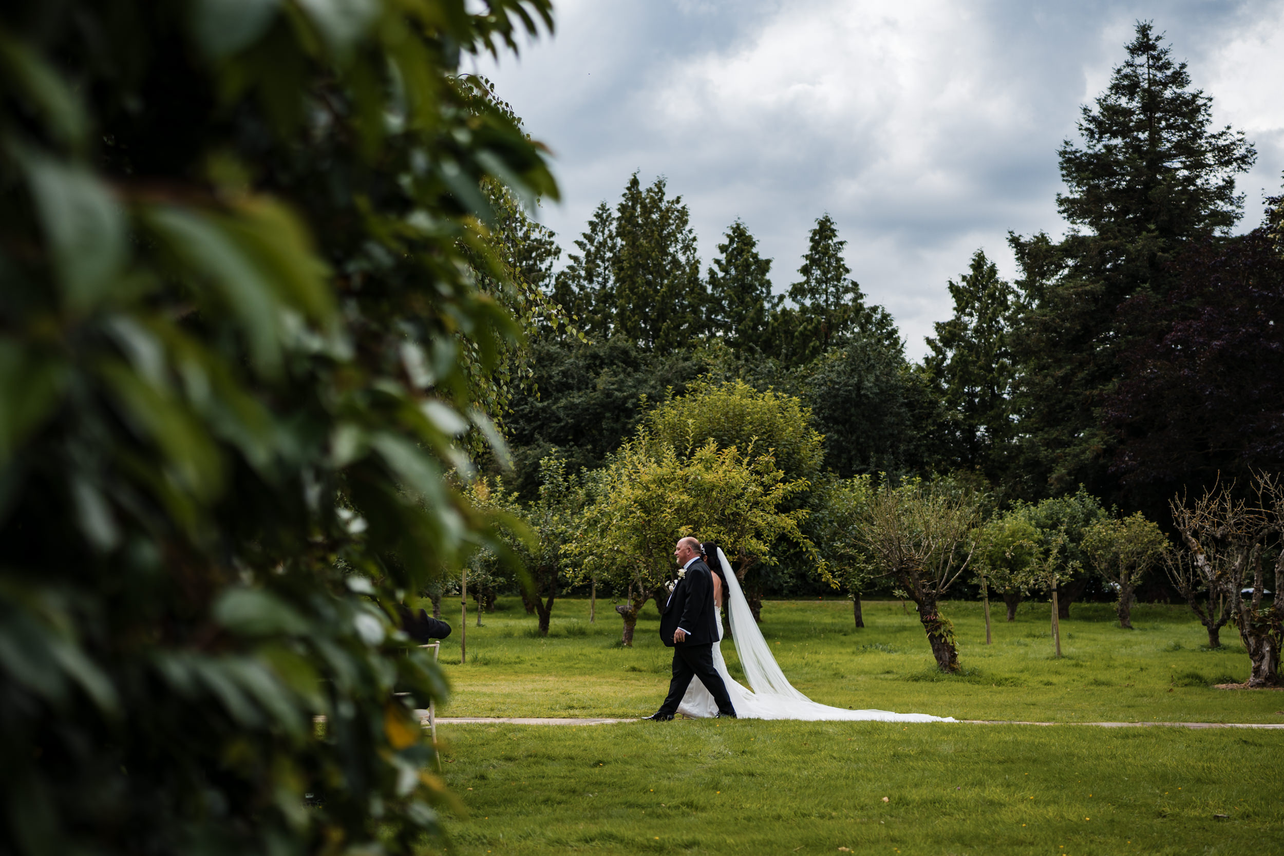 Bride and father walking to the ceremony area.