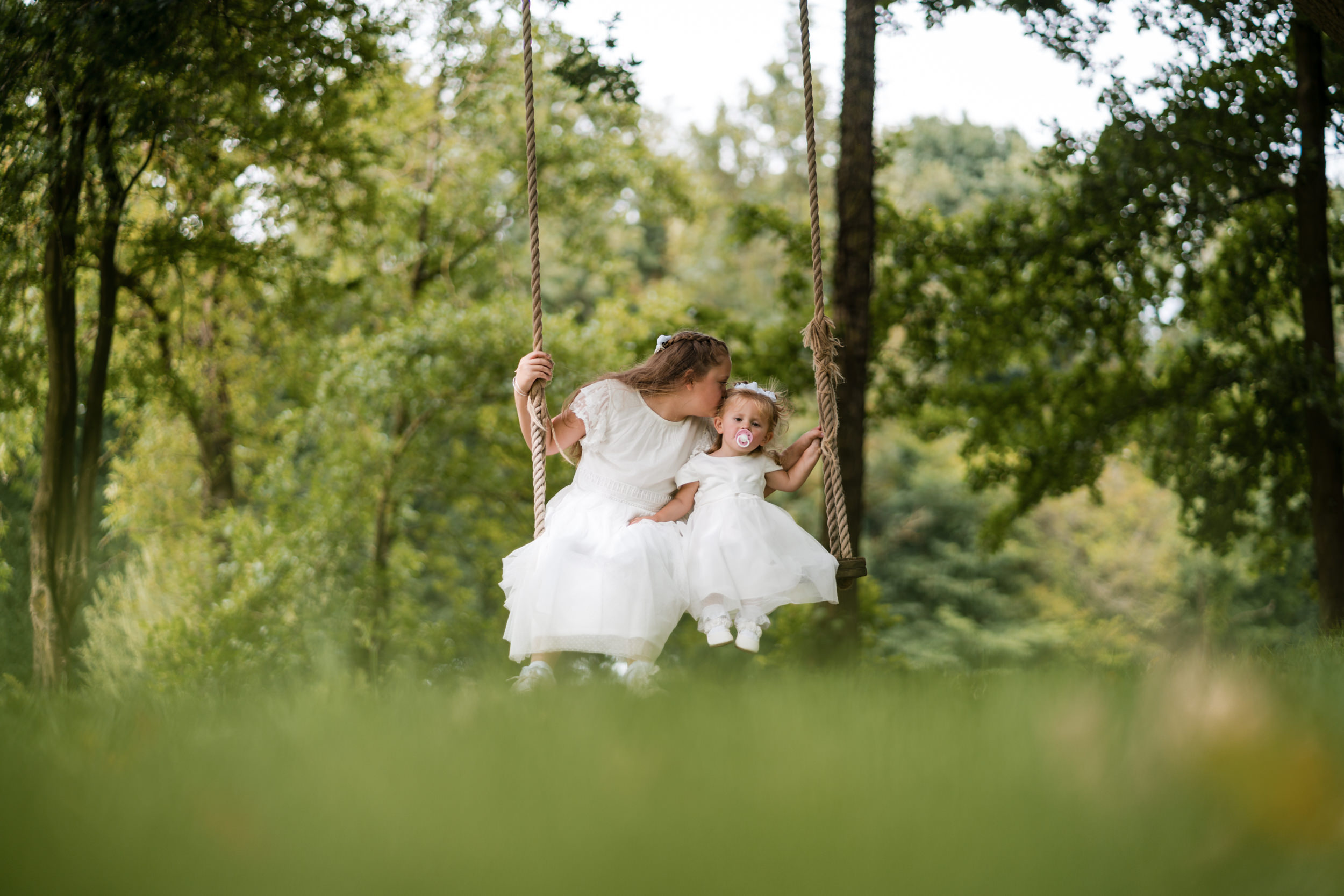 Siblings on a swing